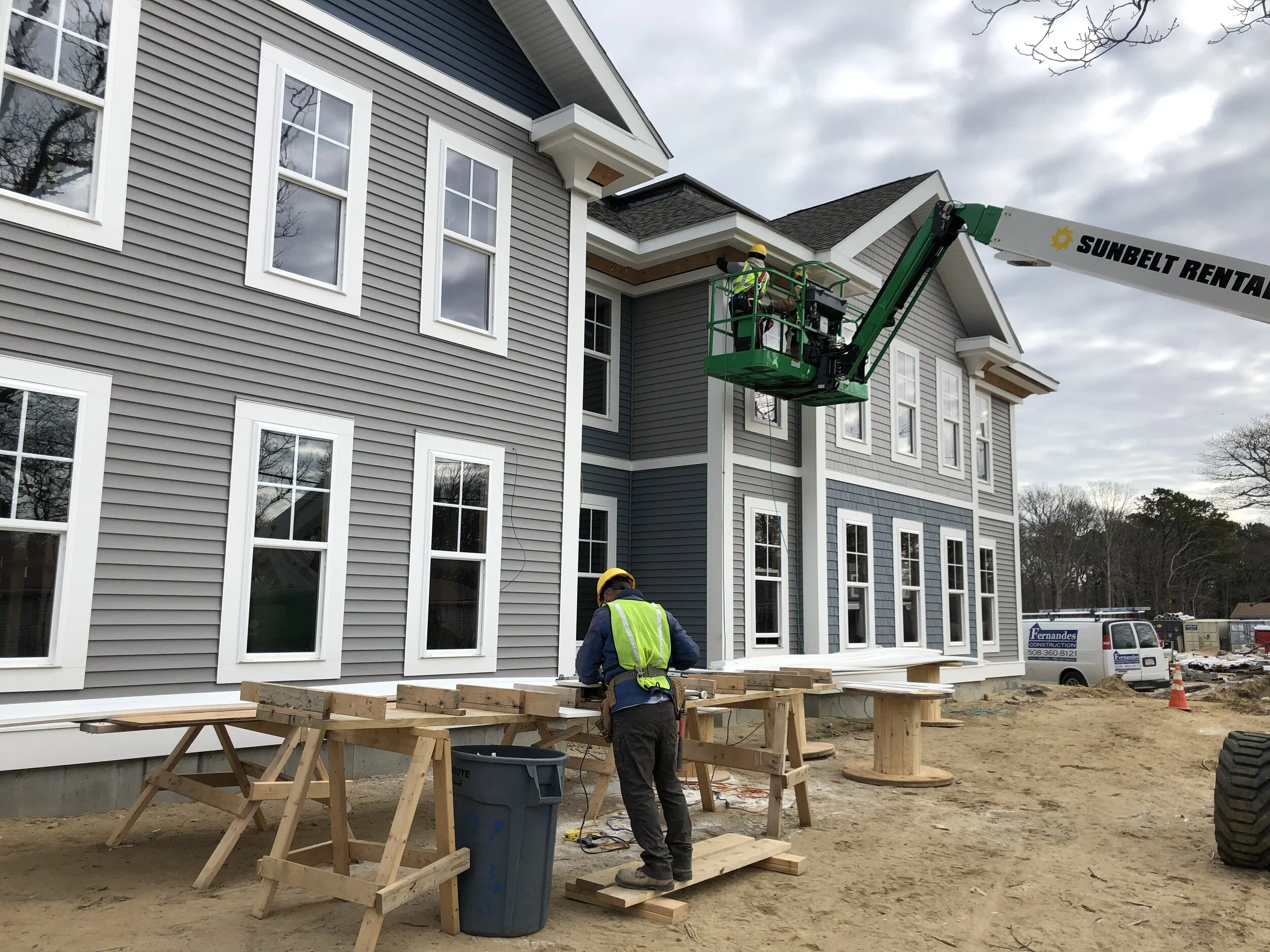 New siding and windows installed on a multi-housing unit on Cape Cod, by Fernandes Construction.