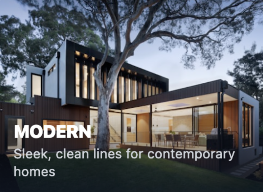 Modern house with sleek, clean lines, large windows, and contemporary design, set among trees with an outdoor patio.
