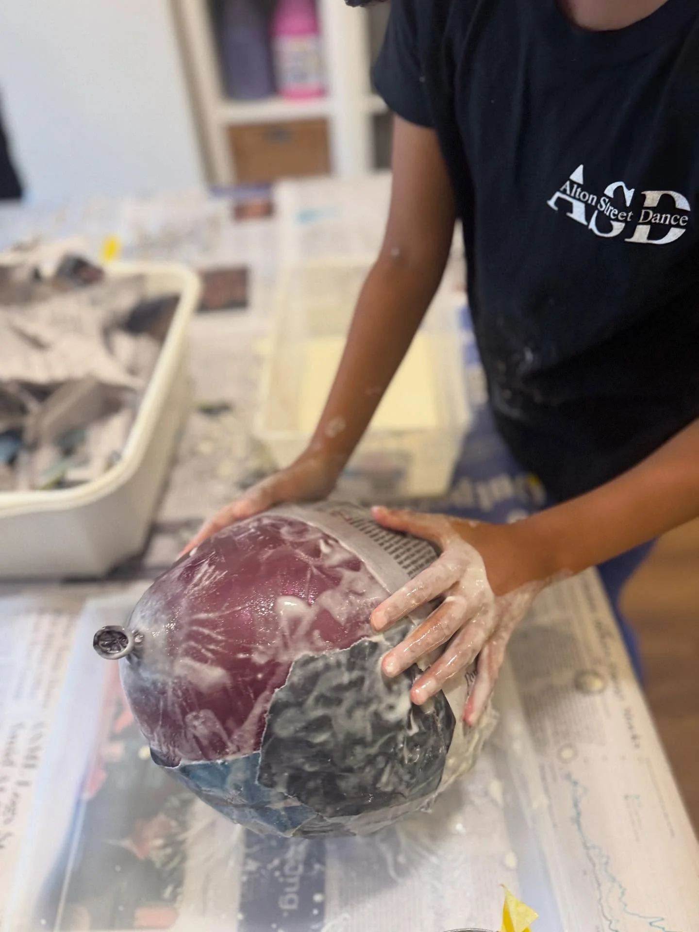 Ooey gooey paper mache fun with our K-2nd grade Afternoon Art Explorers! Children ripped strips of newspaper, mixed up the ingredients for the paper mache paste, and then got to work covering their balloons! Any guesses as to what we’ll turn th