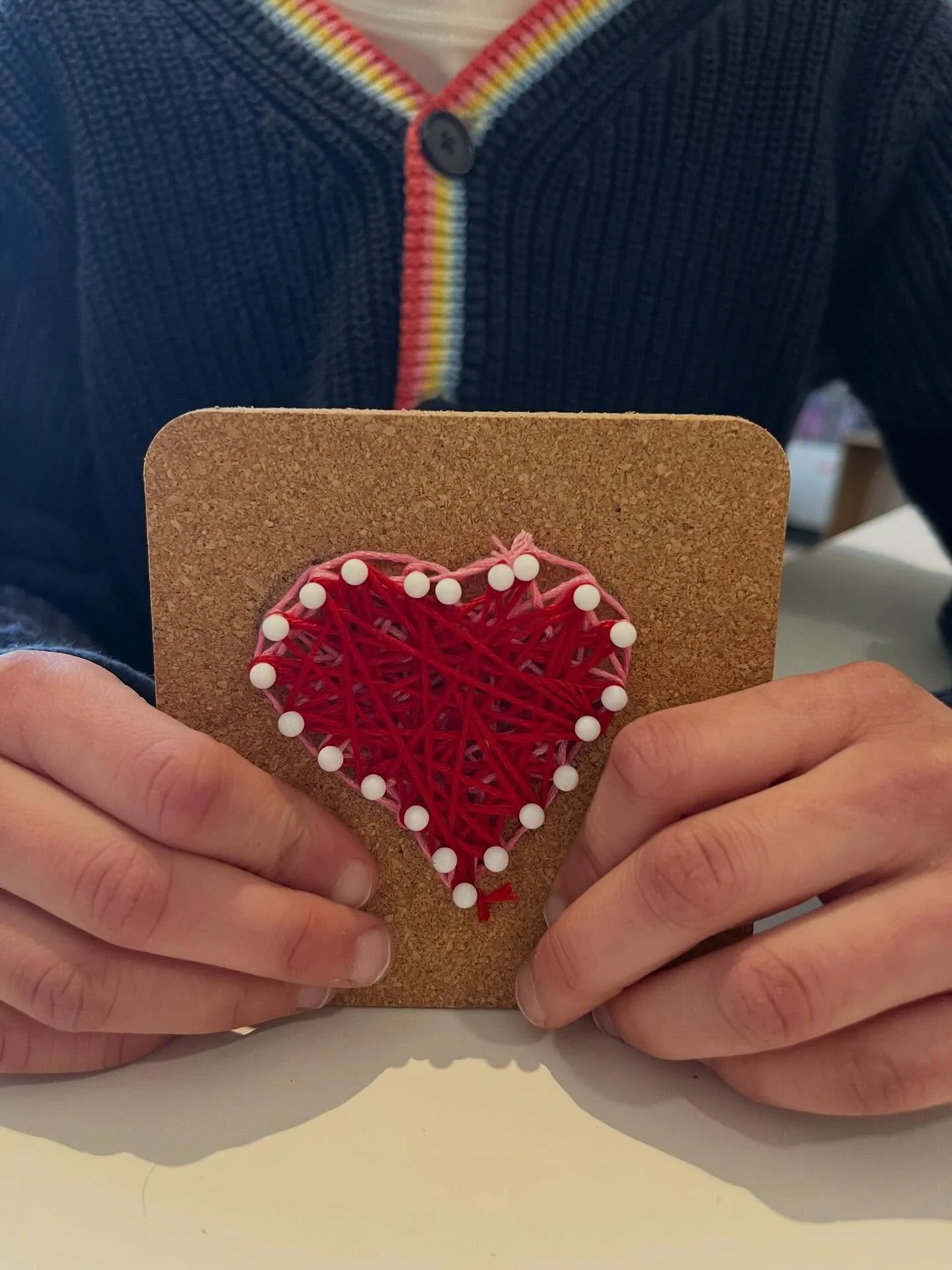 Afternoon Art Explorers (K-2nd grade) created these beautiful string art designs! They drew a shape with pencil, stuck pins in along the shape, and took their time weaving embroidery floss in and out of the pins. What great attention to detail and fi