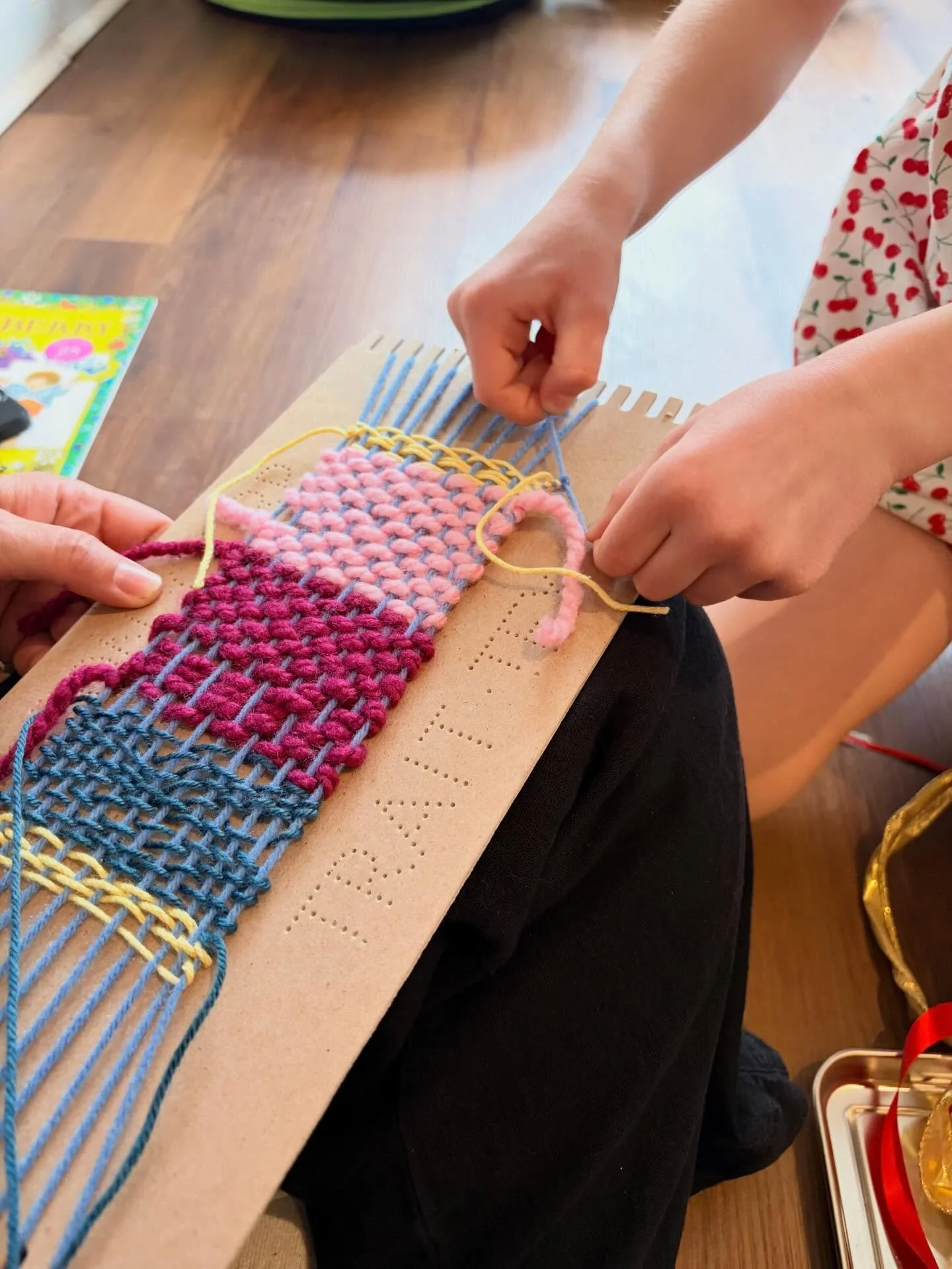 The Wednesday Afternoon Art Explorers enjoyed creating their own woven tapestries yesterday. They learned how to bring their string across in an over/under pattern to create each row. They also enjoyed mixing different colors, textures, and thickness