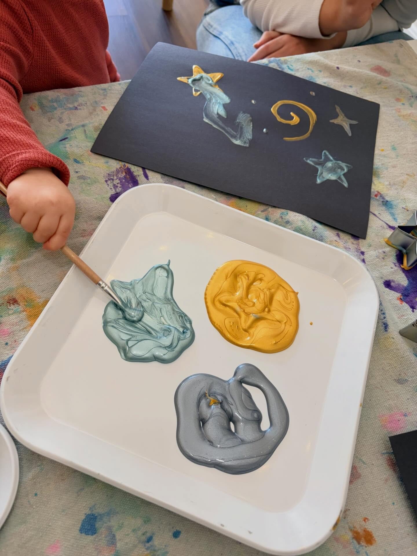 Our stations in Sensory Fun (18 months - 5 years) classes this week were inspired by Van Gogh&rsquo;s Starry Night. Children created nighttime play dough scenes on silver mats, scooped and poured dark blue rice with star scoopers, and used star cooki