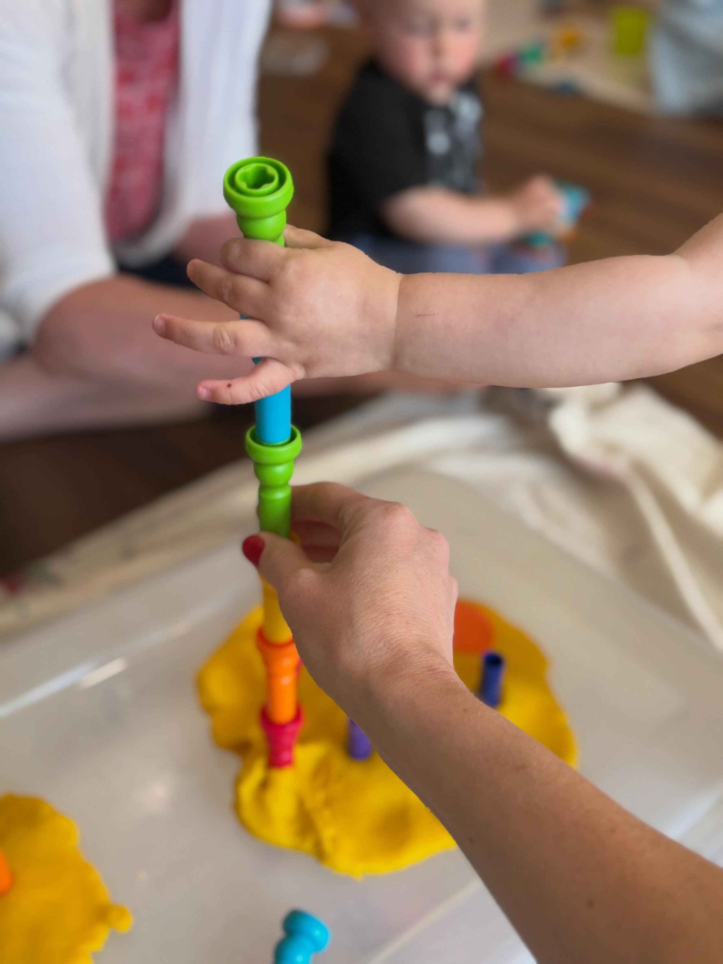 The last Messy Minis class of the year was filled with lots of rainbows and several of our favorite provocations - ping pong balls in water, hide-and-seek shakers, opportunities for building, splashing, laughing, and sharing. And of course, the last 