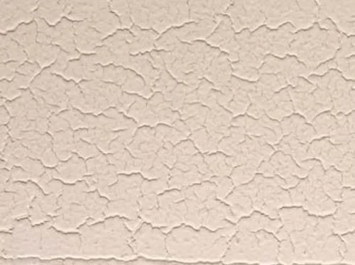 mud cracking on a painted house