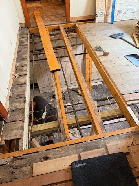 Floor joists being replaced and floor leveled. 