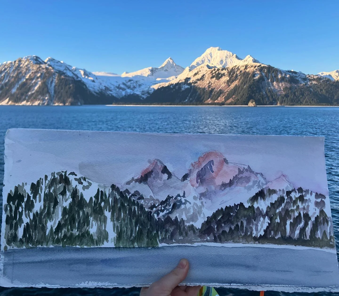 Capturing the sunrise on the mountains towering over Harris Bay, Kenai Fjords NP while on the @rvsikuliaq