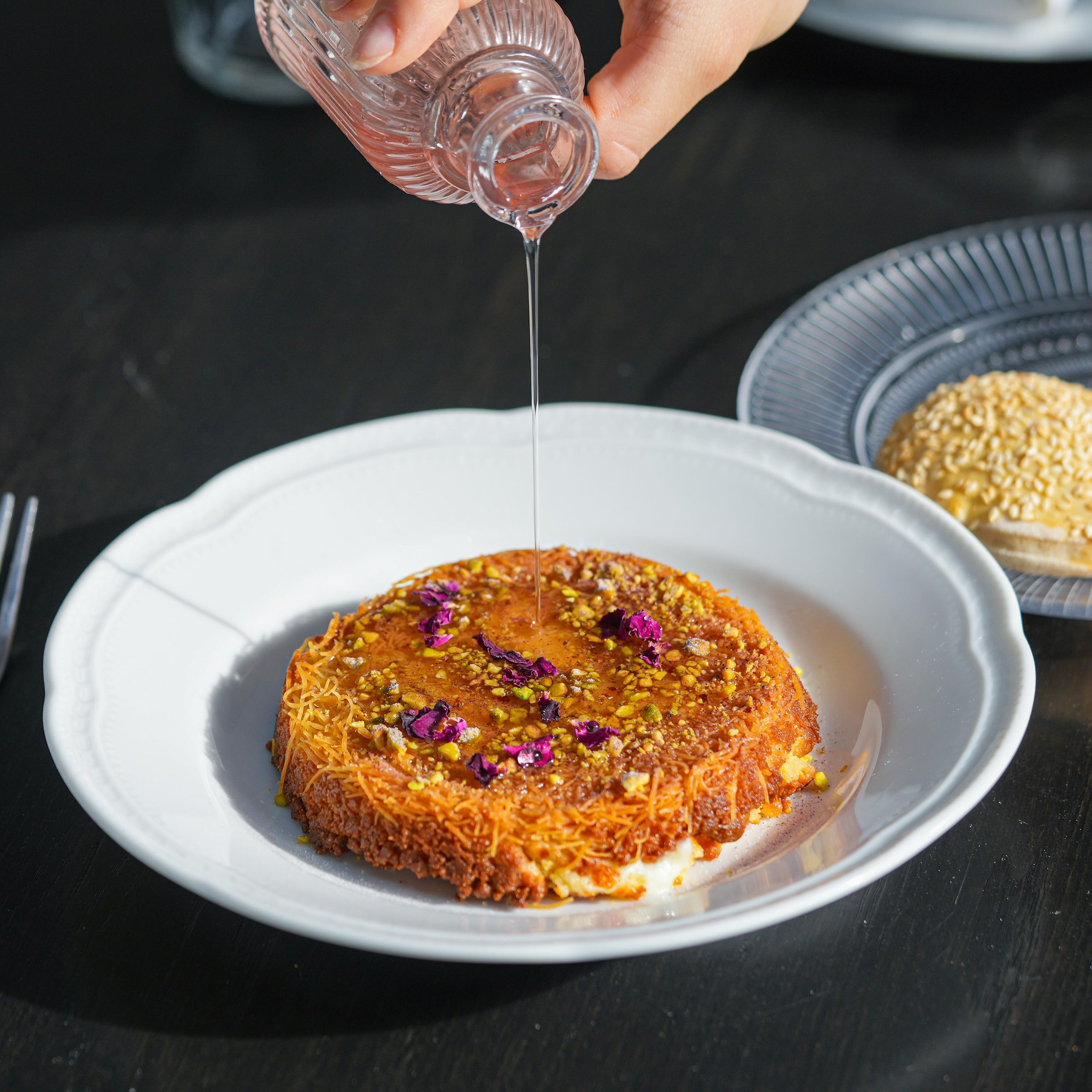 Suraya's Kanafeh for 2 gives new meaning to &quot;save room for dessert.&quot; This is a traditional Lebanese dessert of crispy kataifi and semolina surrounding melted fresh cheese curd, finished with rose blossom syrup and pistachios. Perfection on 