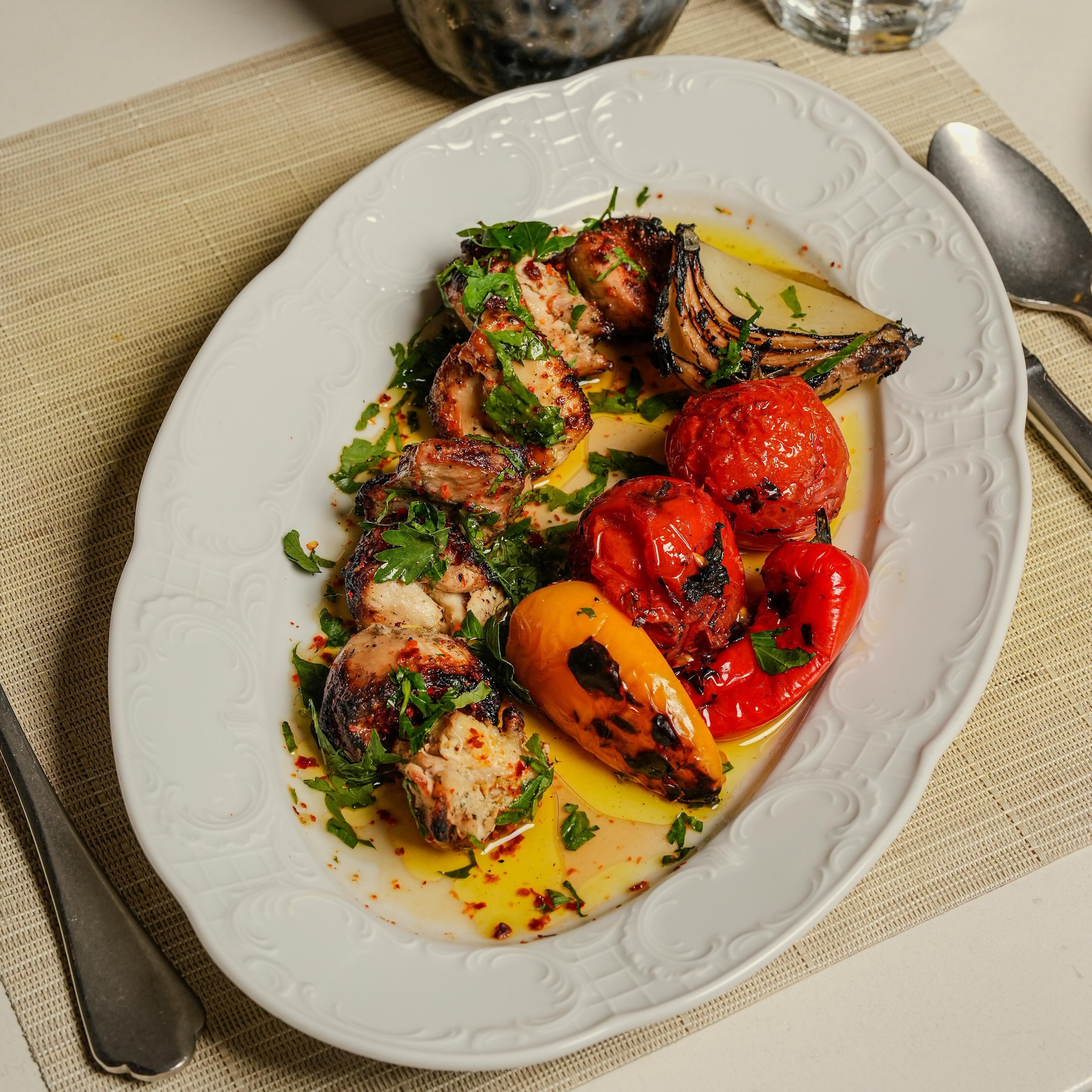 This brunch favorite is on special on our menu for lunch this week! Shish Taouk &mdash; Yogurt-marinated chicken kebab served with garlic toum and charred onions, tomatoes, and peppers