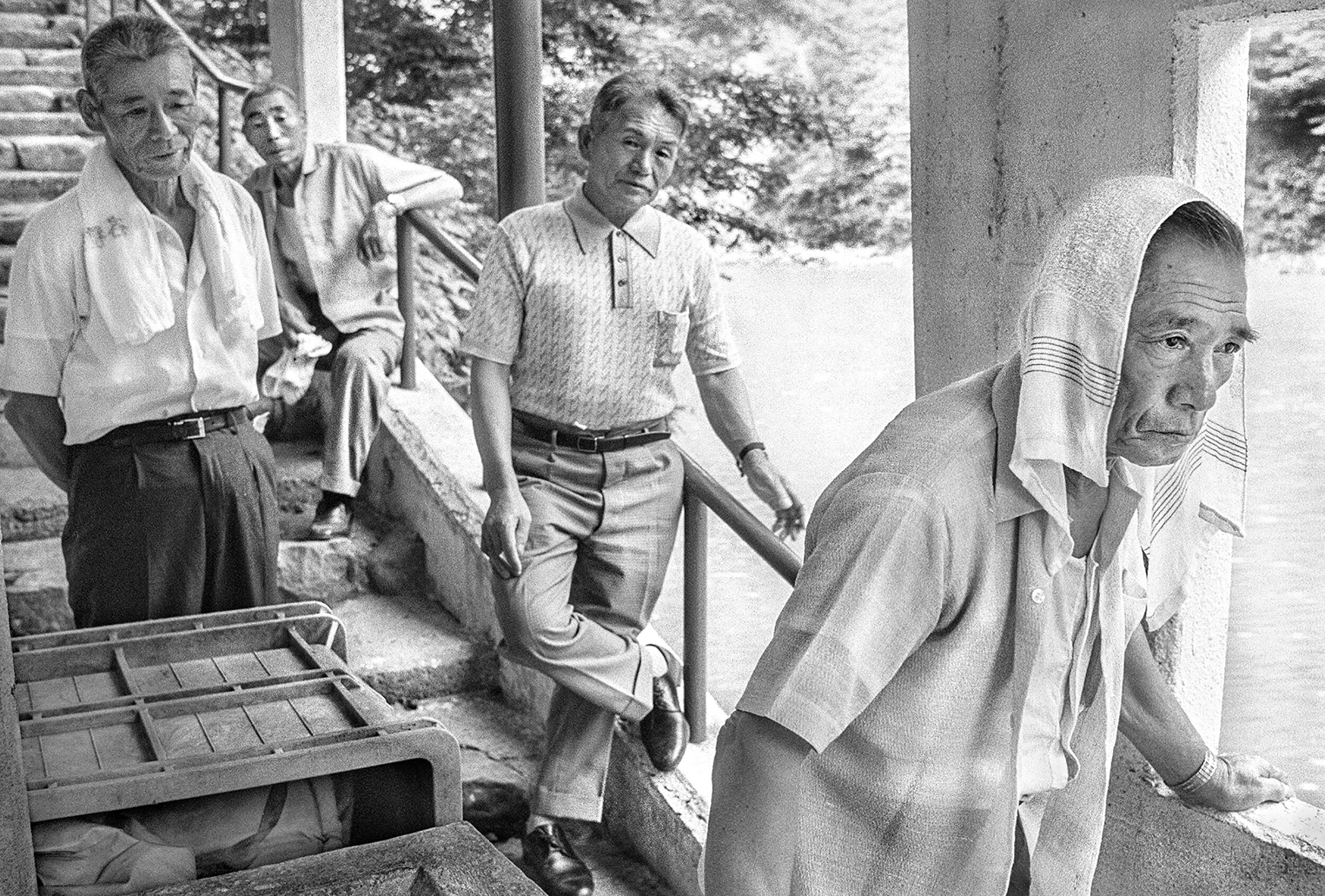 After the onsen (bath), waiting for the river ferry near Gokoyama, Toyama prefecture, July 1977.