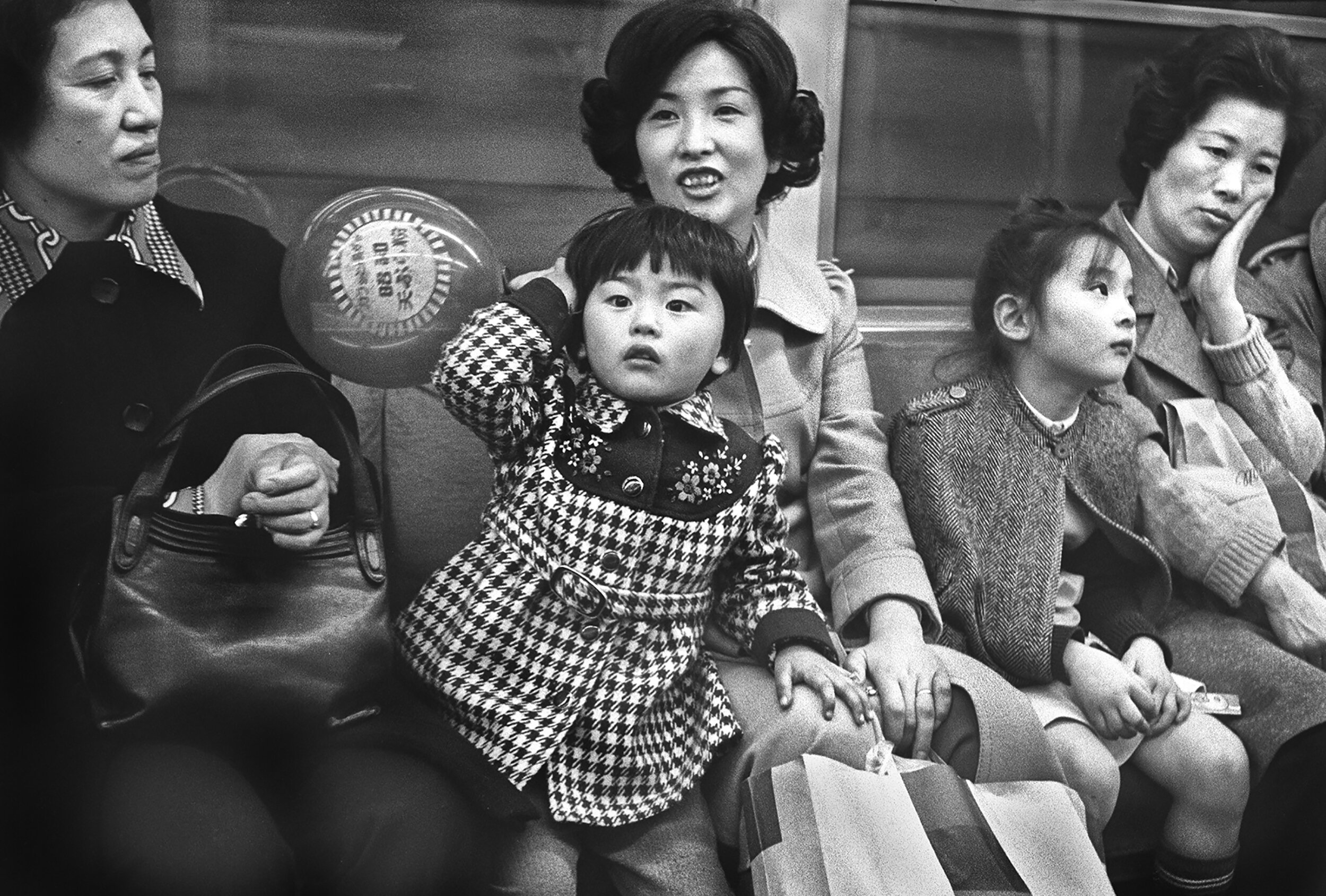 Mothers and daughters on the subway, February 1977.