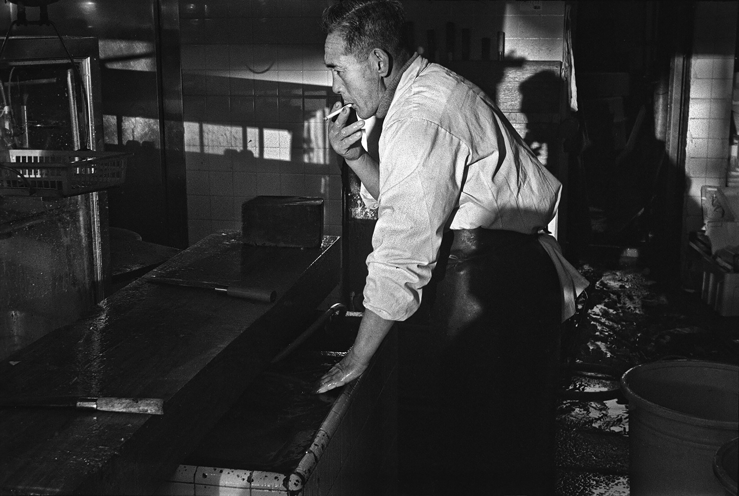 Fishmonger taking a break, Zushi, Kanagawa-ken, January 1977.
