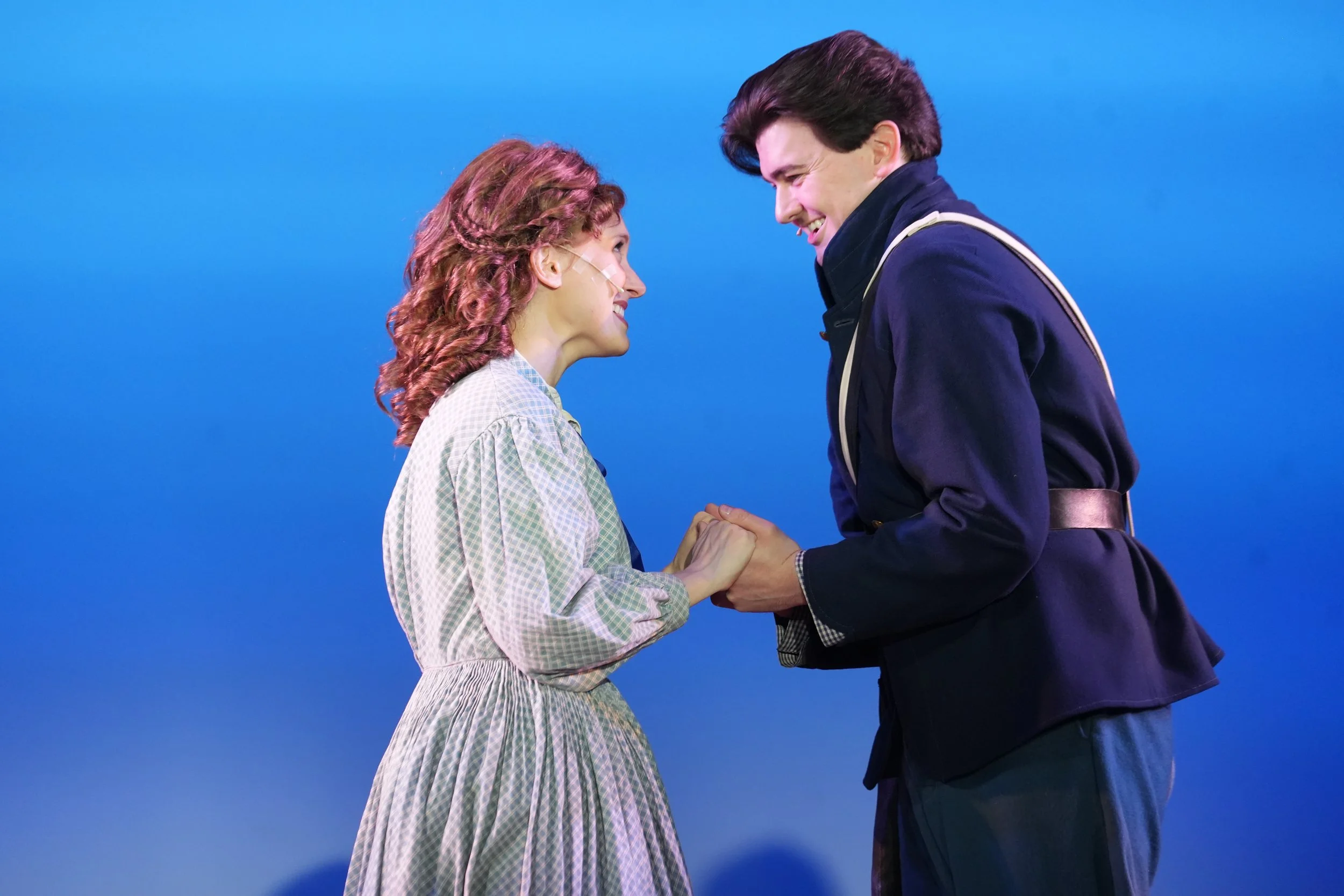 Jarrett Bloom as 'John Brooke' in "Little Women" (2026) at the Riverside Center for the Performing Arts, with Sarah Mae Andersen as 'Meg March'