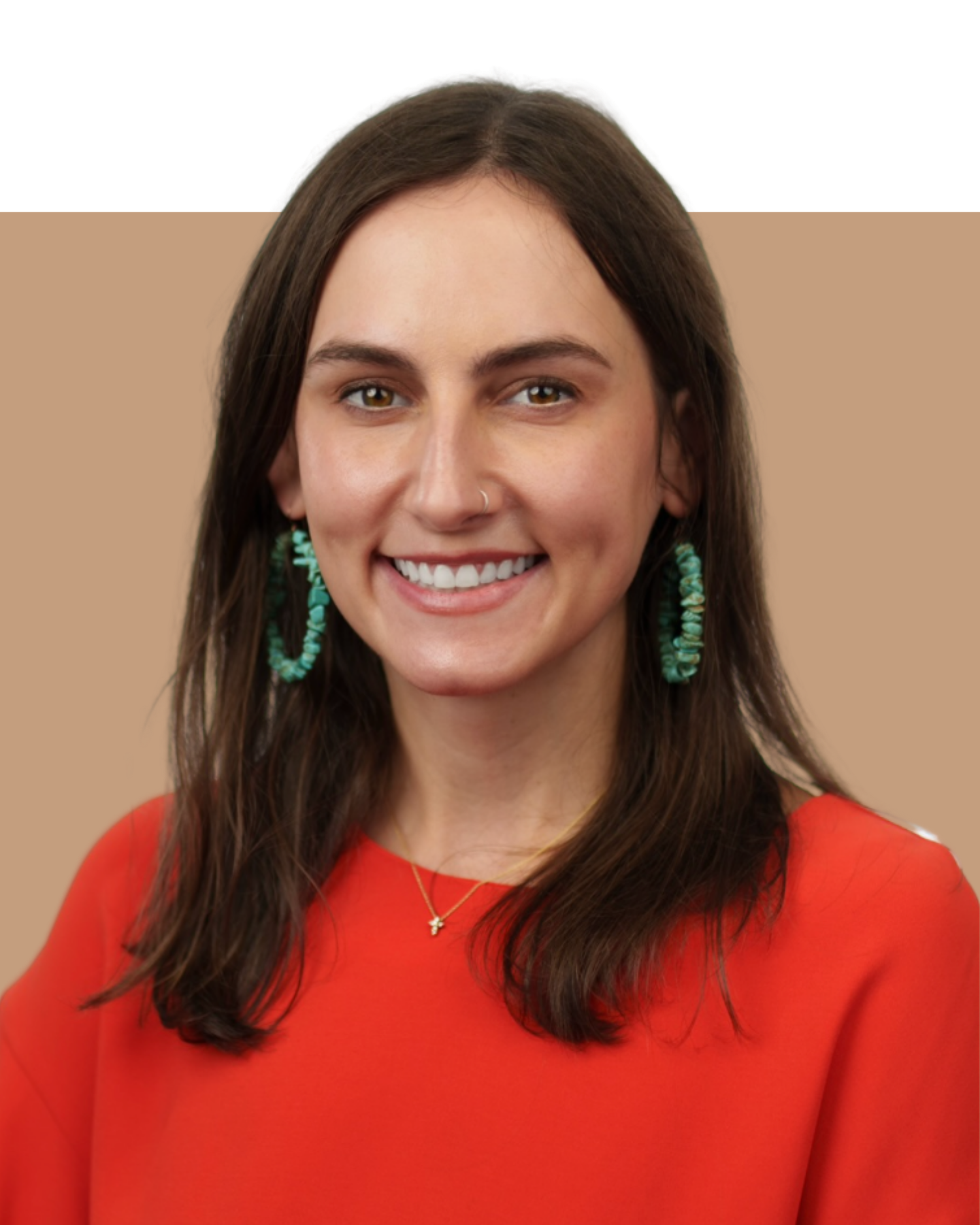 A smiling woman with long brown hair, wearing a red top, turquoise hoop earrings, a delicate gold necklace with a small pendant, and a small nose ring. The background is split into a black upper half and a beige lower half.