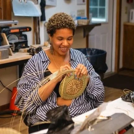 Olamina co-founder Jada Patterson weaves a sweetgrass basket