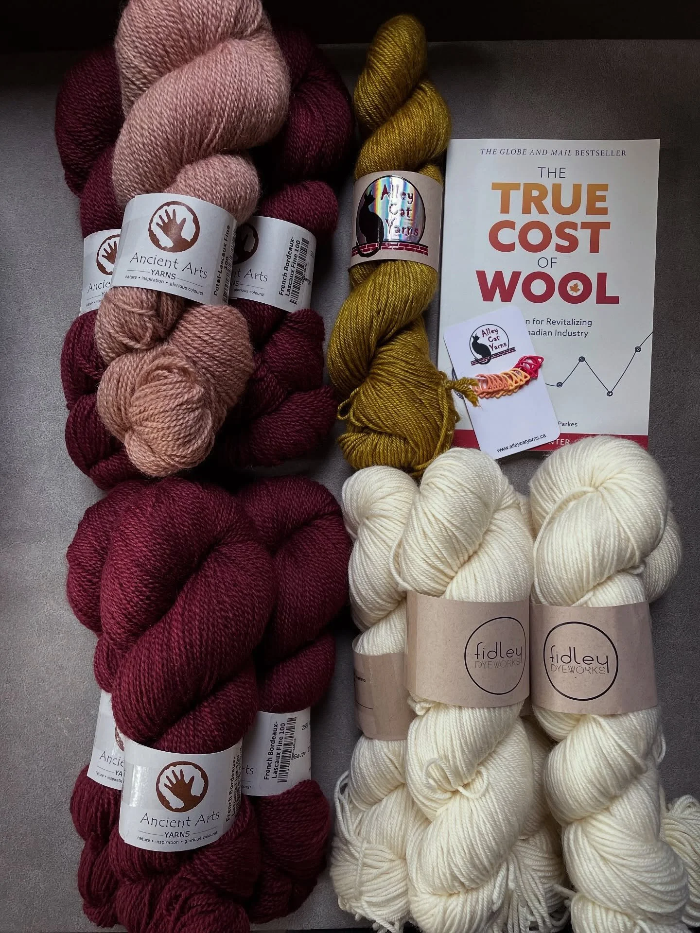 Pleased as punch with the treasures I found at Knit City 💕
&bull;
@ancientartsyarn Lascaux Fine in Bordeaux and Petal for something light and colourwork-y 
&bull;
@fidleydyeworks SW Merino DK (bare) for an Ashcroft cardigan for my mom 
&bull;
@alley