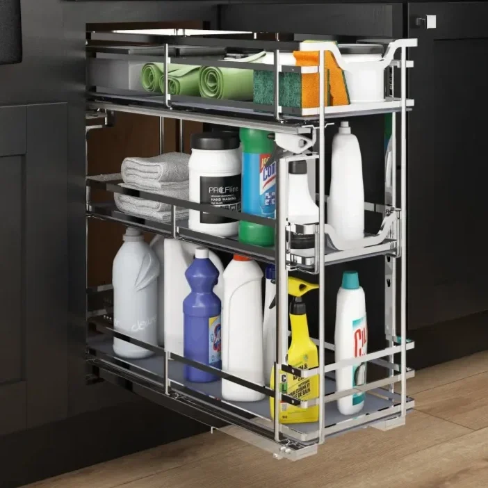 Pull-out kitchen cabinet organizer with cleaning supplies, including spray bottles, detergent, scrub sponges, and cleaning cloths.