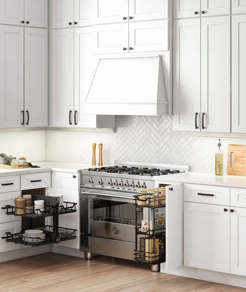 Kitchen with white cabinets, stainless steel oven, and black wire storage racks holding dishes and jars.
