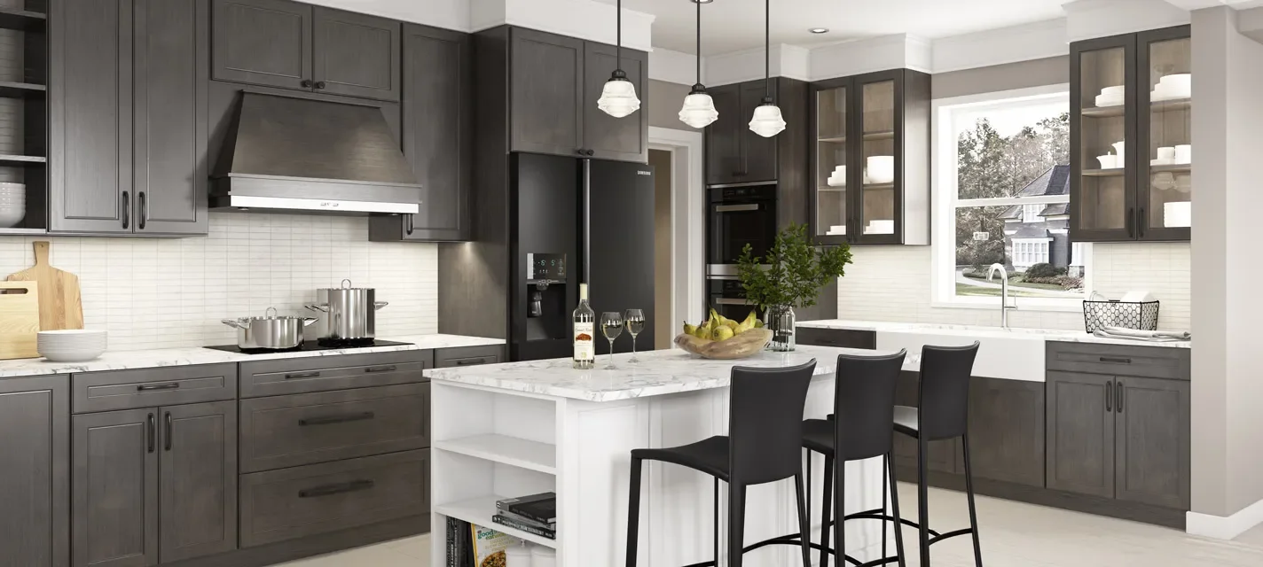 Modern kitchen with dark gray cabinets, white marble countertop island, black bar stools, and a window over the sink showing a suburban neighborhood.
