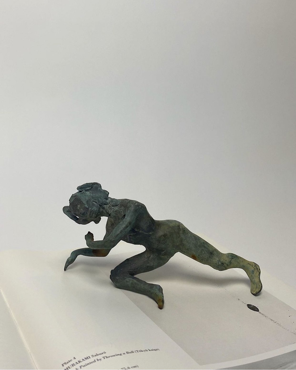 Hand-cast male figure with patina via Revel Interiors