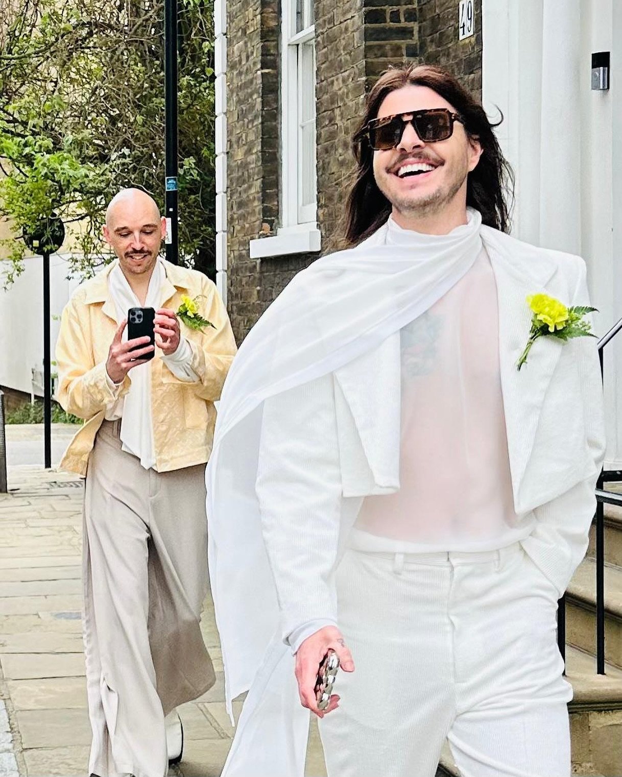 @robbiesinclairdotcom strutting through the streets of London, en route to a special ceremony 💘, wearing the &lsquo;Holmes&rsquo; &amp; &lsquo;Bannon&rsquo; corduroy suit now available in white 🤍 &amp; &lsquo;Rosser&rsquo; pussy bow chiffon shirt f