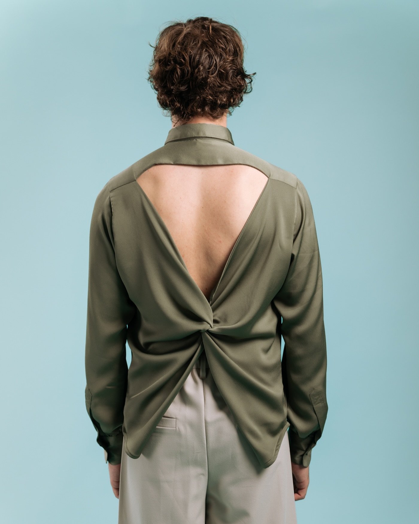 🤩 **NEW COLOUR** The Bellamont shirt is the perfect show stopper. Cut from a sumptuous bubble satin with a classic collar and billowing poet sleeves. The open back twists into a dramatic knot detail that epitomises decadence and glamour.

This speci