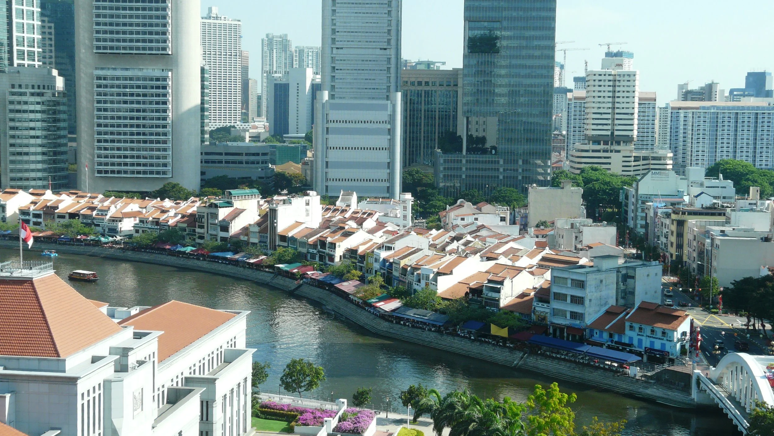 Craft cocktails served on a high-rise rooftop lounge overlooking the Marina Bay skyline.