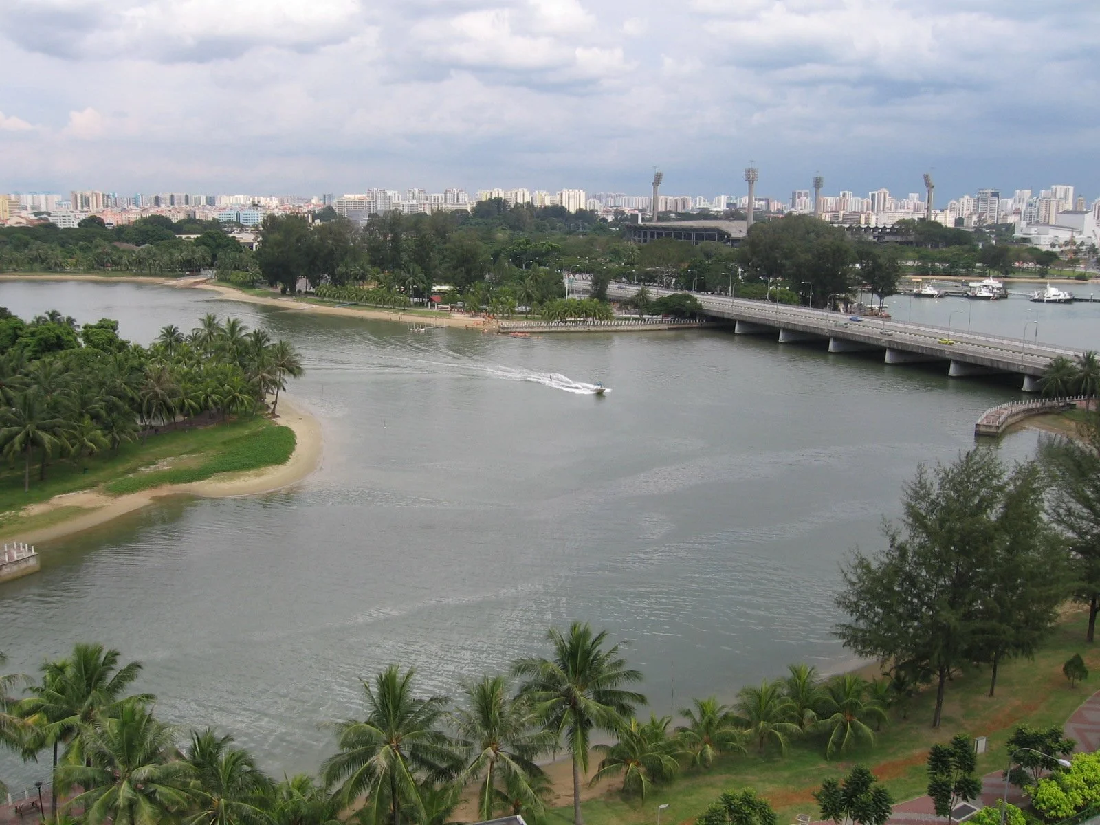 Participants engaging in an outdoor waterfront fitness carnival at Kallang Riverside Park.