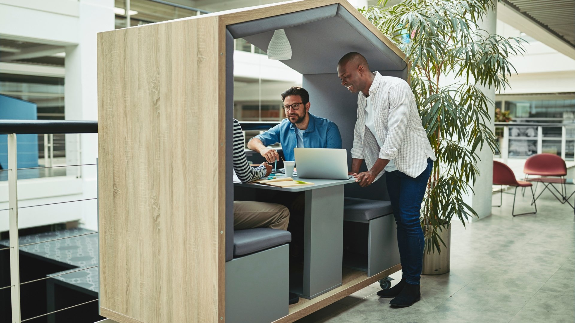 : Future office design in Singapore featuring focused work pods.