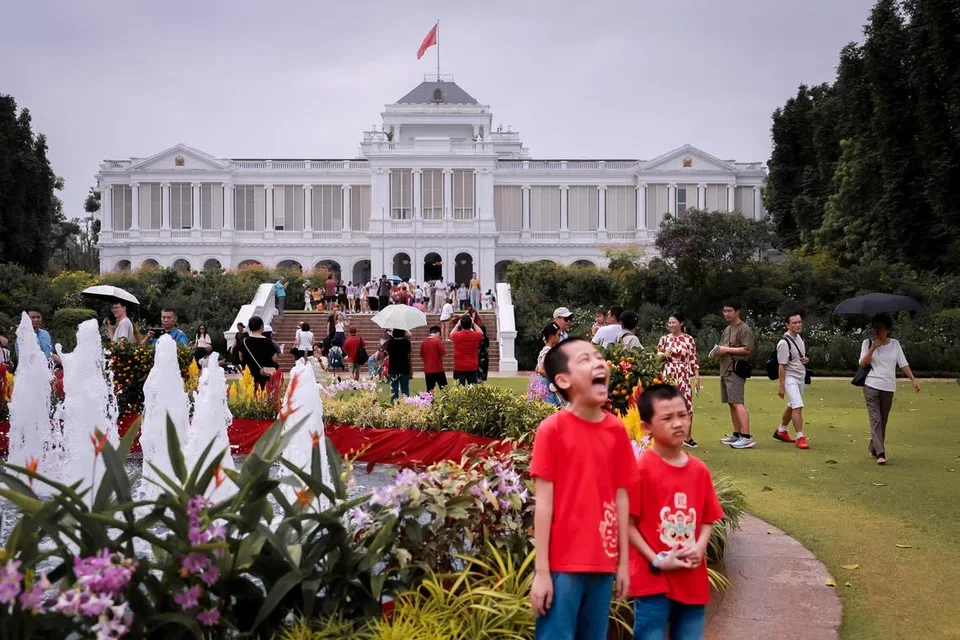 Lush greenery and colonial architecture of the Istana main building.