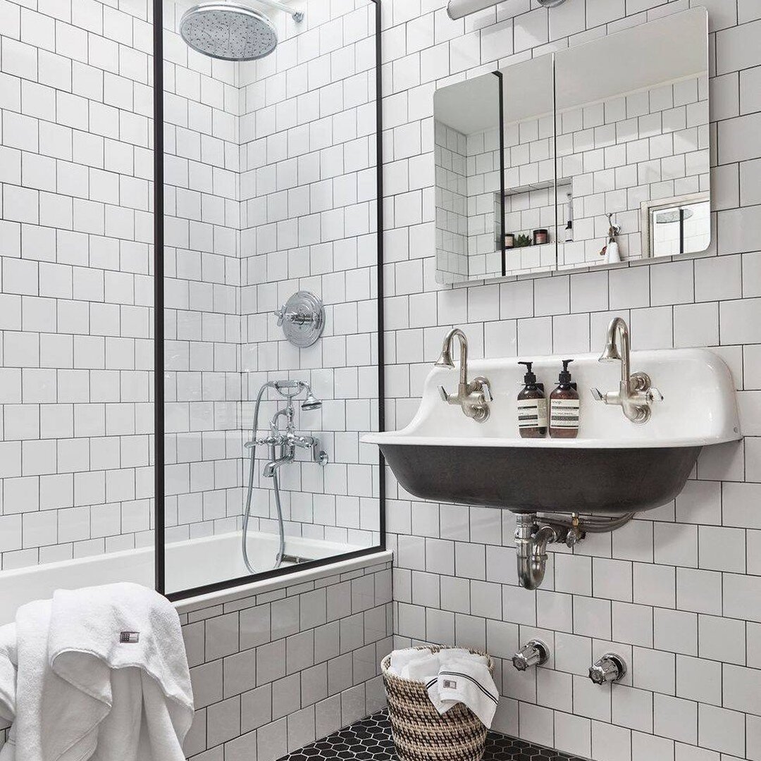 Trick of the eye . . .
Play with boundaries of perception by tiling the side of your bath and wall with the same tile. This makes it hard to distinguish where each begins, thereby making your bathroom feel bigger.

Another clever trick is to use the 