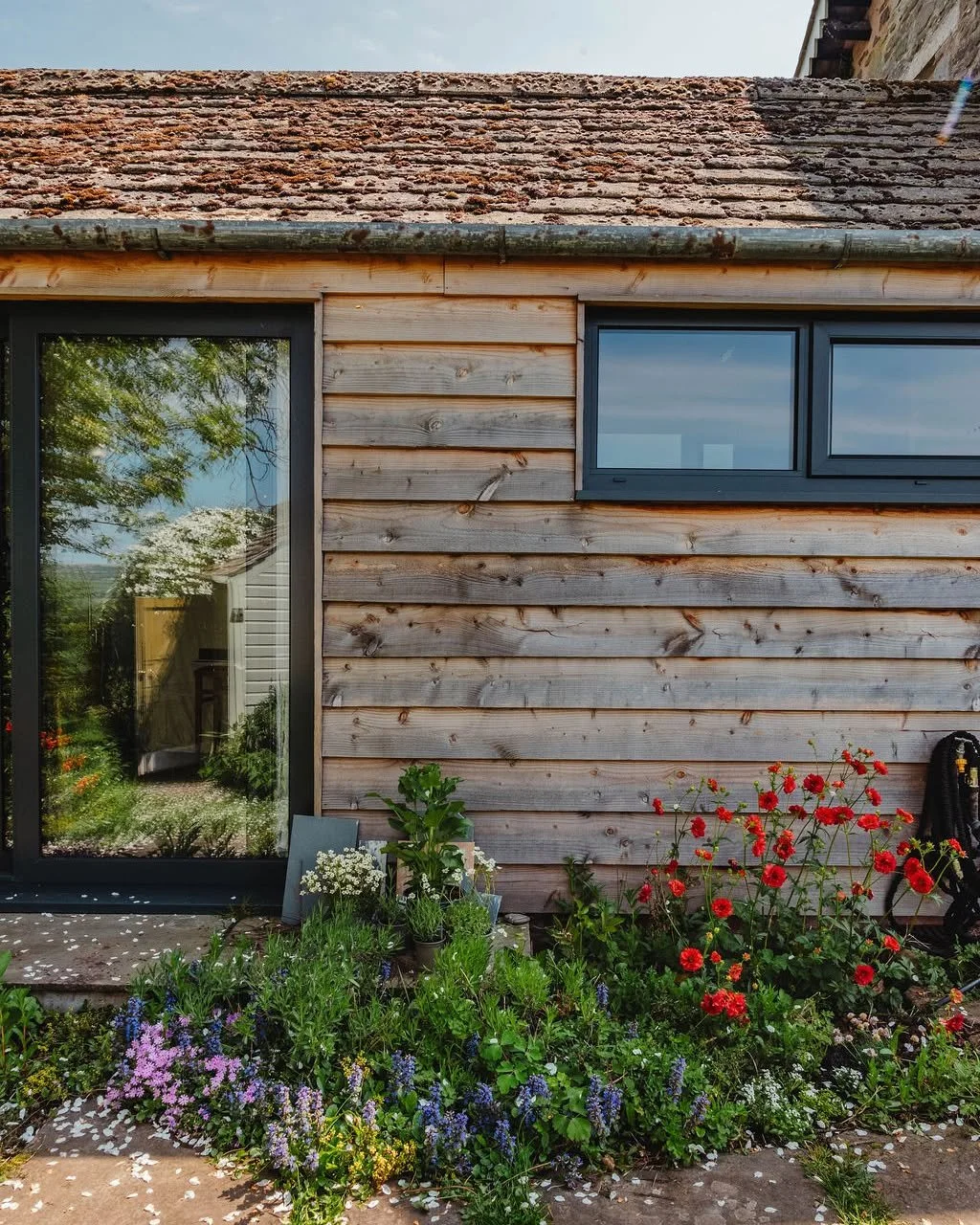So much attention in design goes to what happens once you step inside, the finishes and the atmosphere of the rooms. But the exterior is just as important.

The outside of a building is the first impression, the element that meets the landscape. Clad