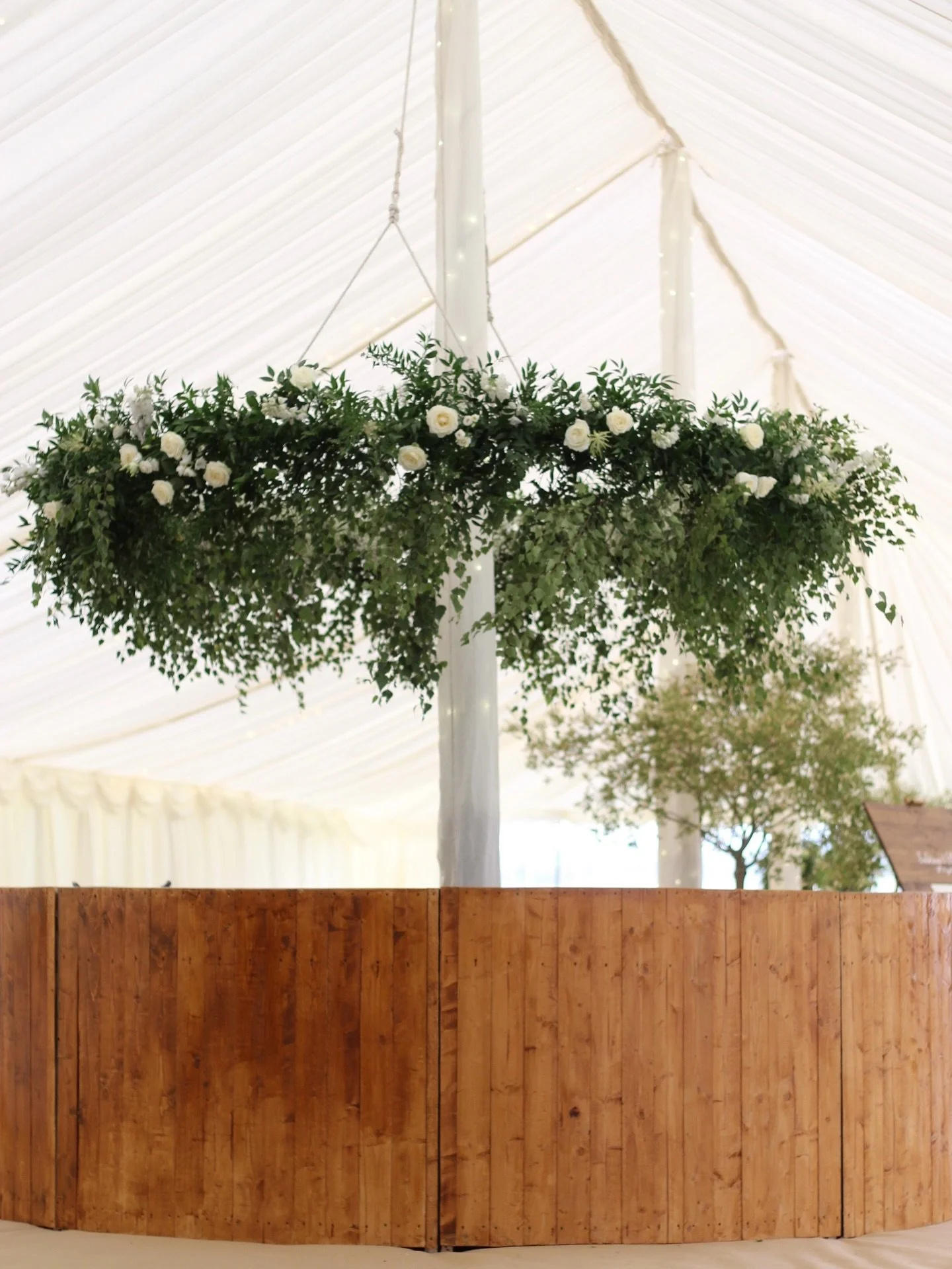 3m luxurious floral bar chandelier. Such a perfect way to bring texture and some verdant lushness into an all White marquee from @archersmarqueesltd 

#marqueeflowers #marqueebar
#marqueewedding #somersetflorist #wiltshireflorist
