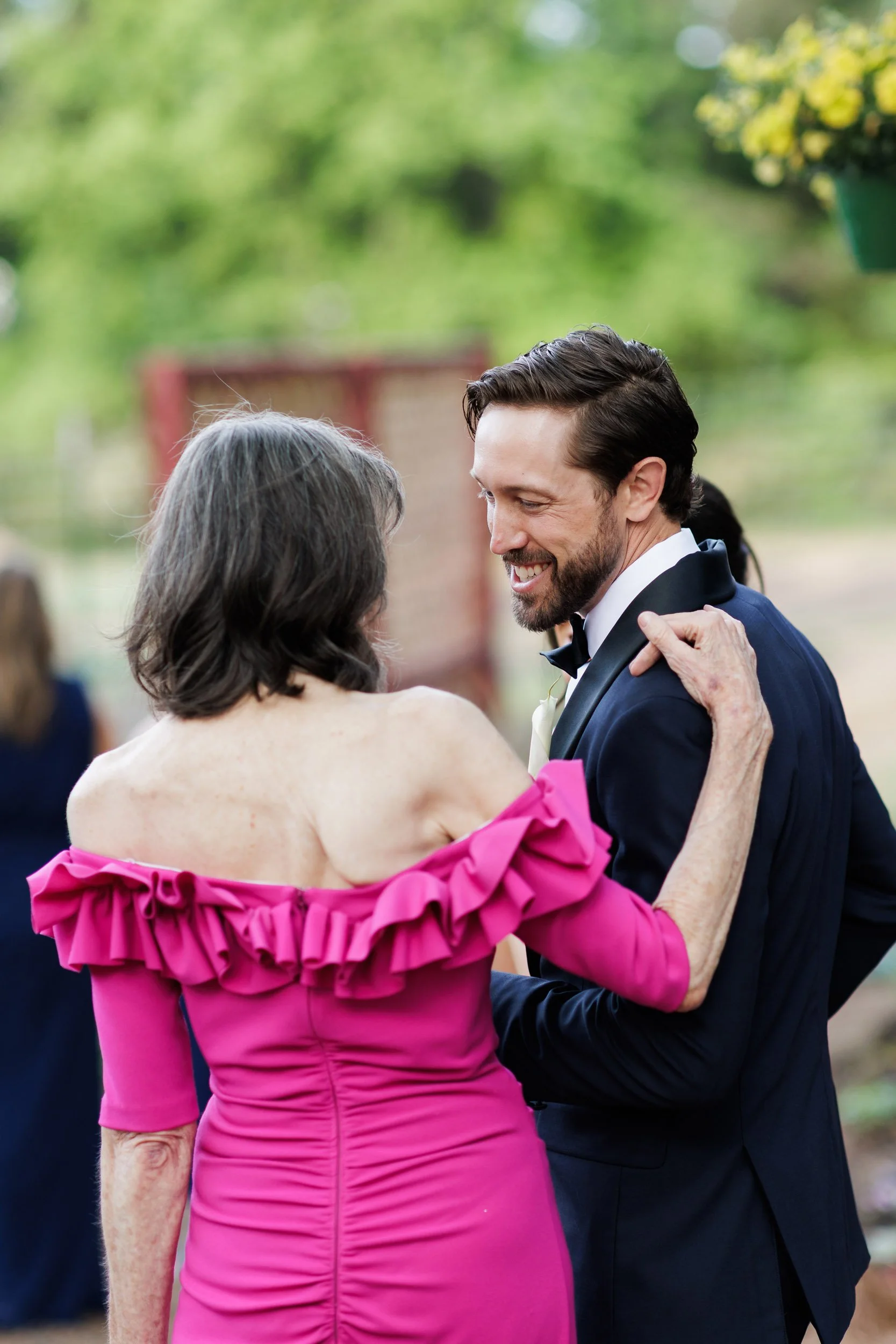 Guest Greeting Groom at Cocktail Hour