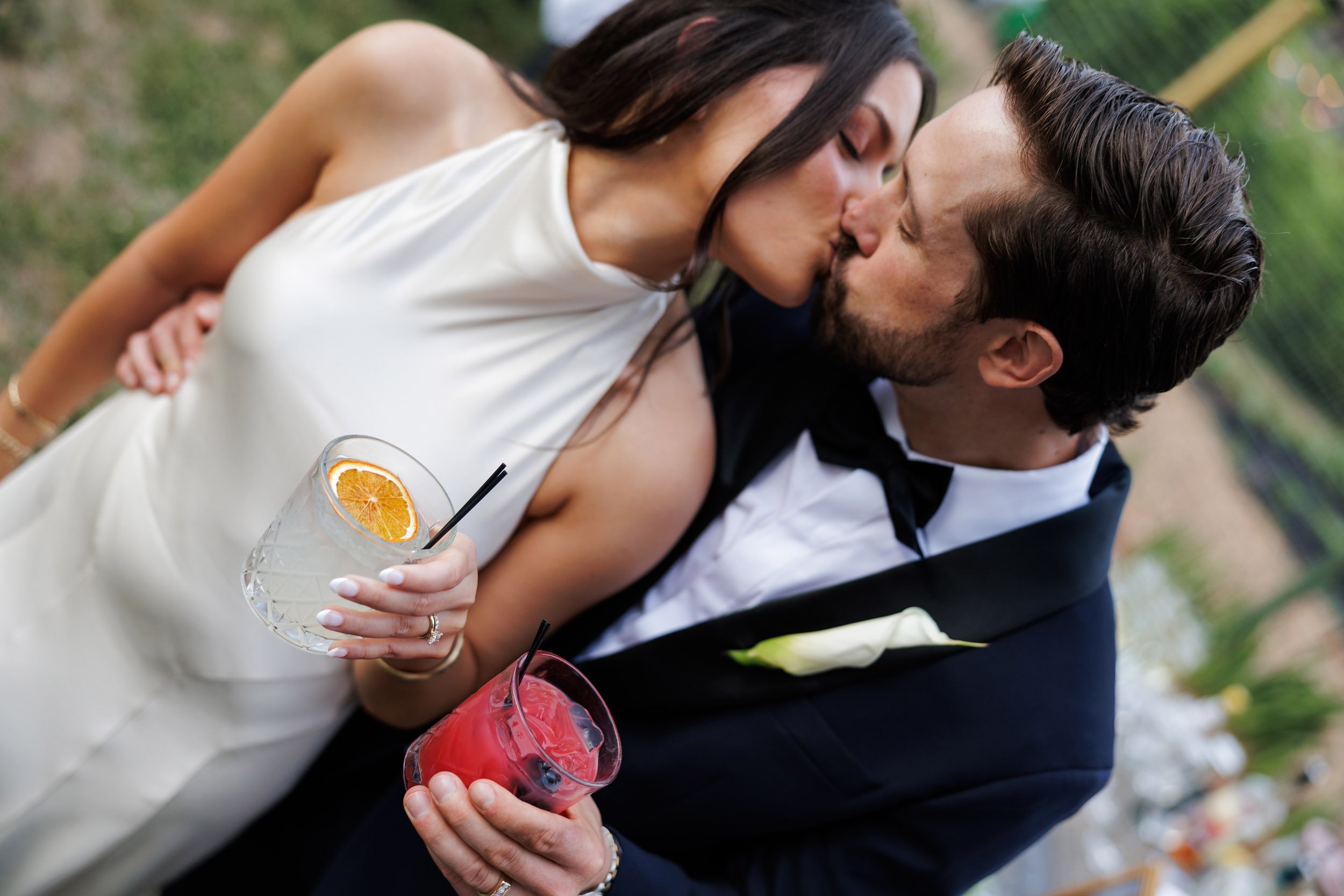 Candid Kiss at Cocktail Hour