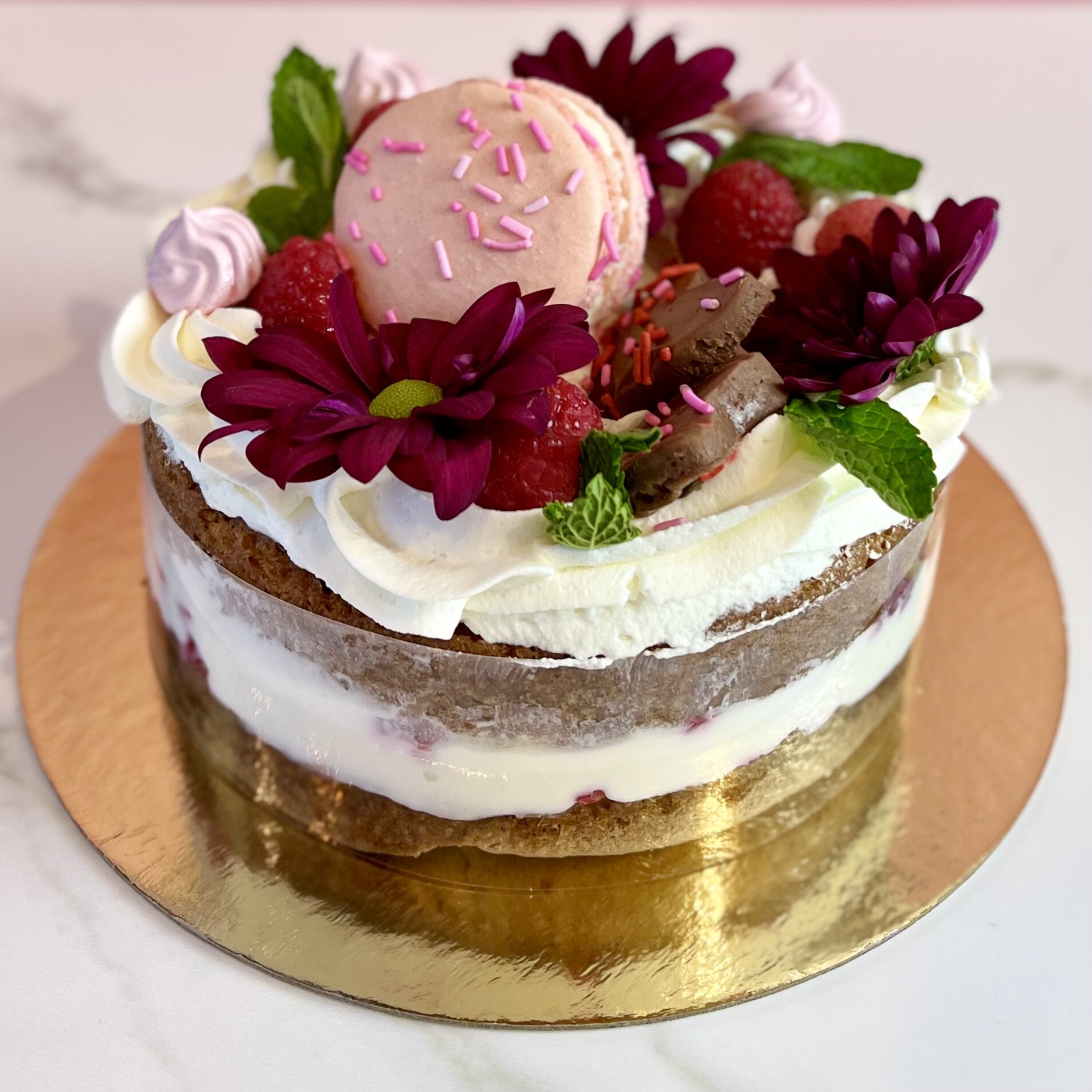 Available for preorder this Valentines!
6&quot; Raspberry White Chocolate Cake
Two layers of white cake, filled with raspberry white chocolate mousse, topped with whipped cream, raspberry meringues, milk chocolate fudge hearts and a macaron. 
$30.00
