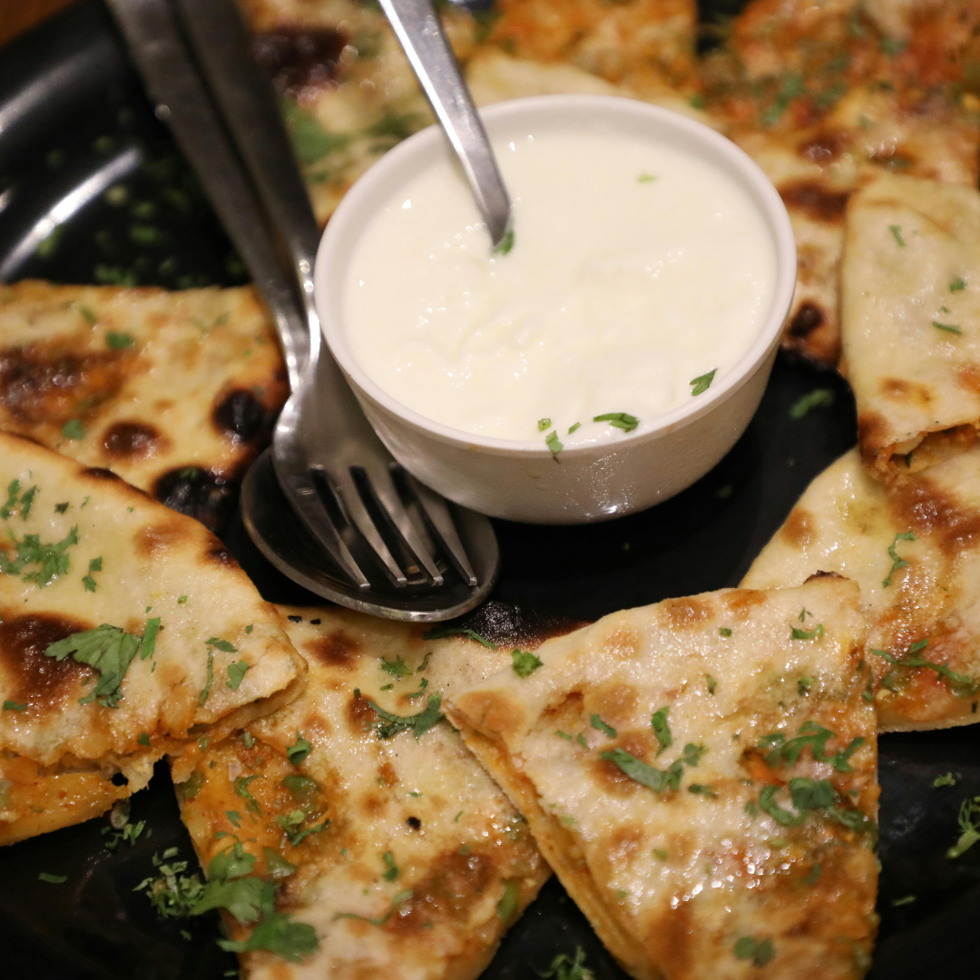 A Complete Guide to Indian Breads: From Naan to Laccha Paratha to Poori