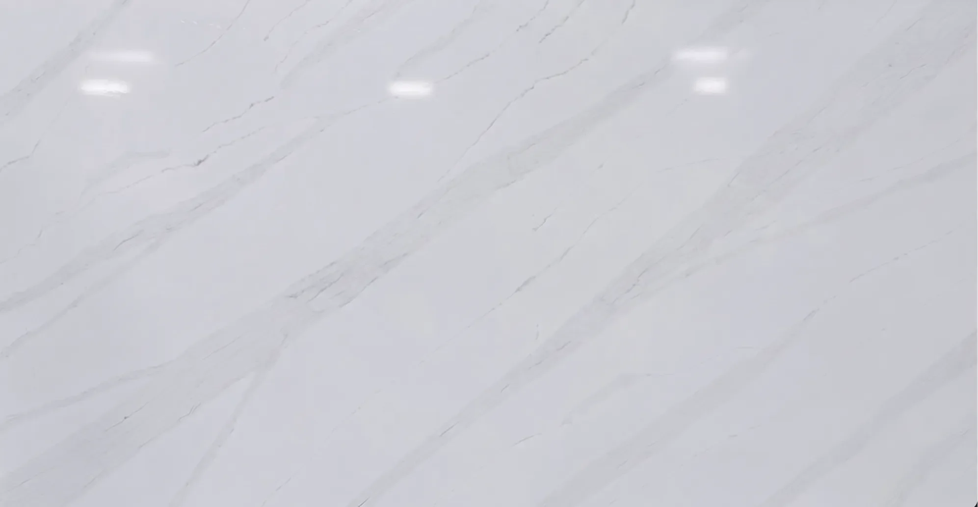 Calacatta Florence Quartz Premium Slab- White background with light grey veins with minimal brown undertones 