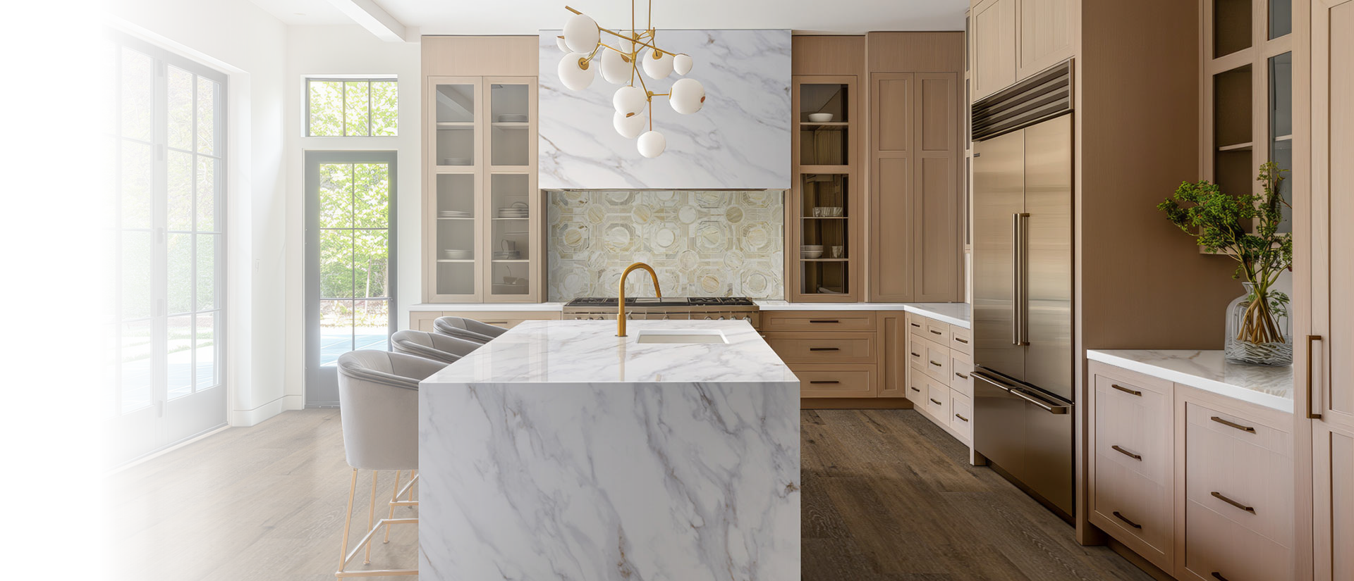 White oak modern kitchen cabinets and luxury quartz with grey and brown veins