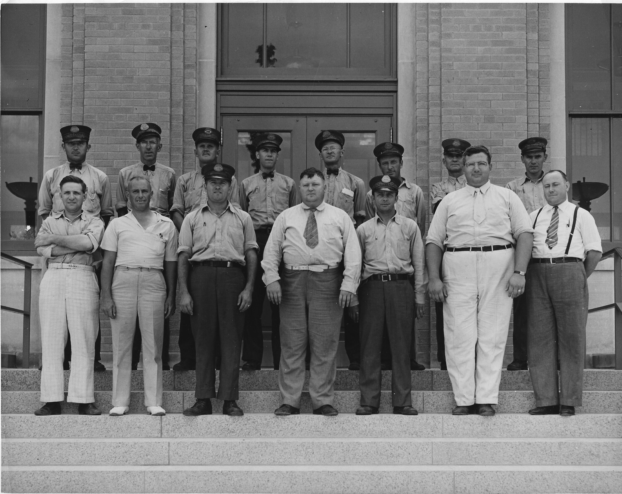 The employees of the Lincoln Park post office on the steps of the new post office; postal superintendent James V. Southers stands front row center [1939 photo by Morris Sager Studio, Lincoln Park]