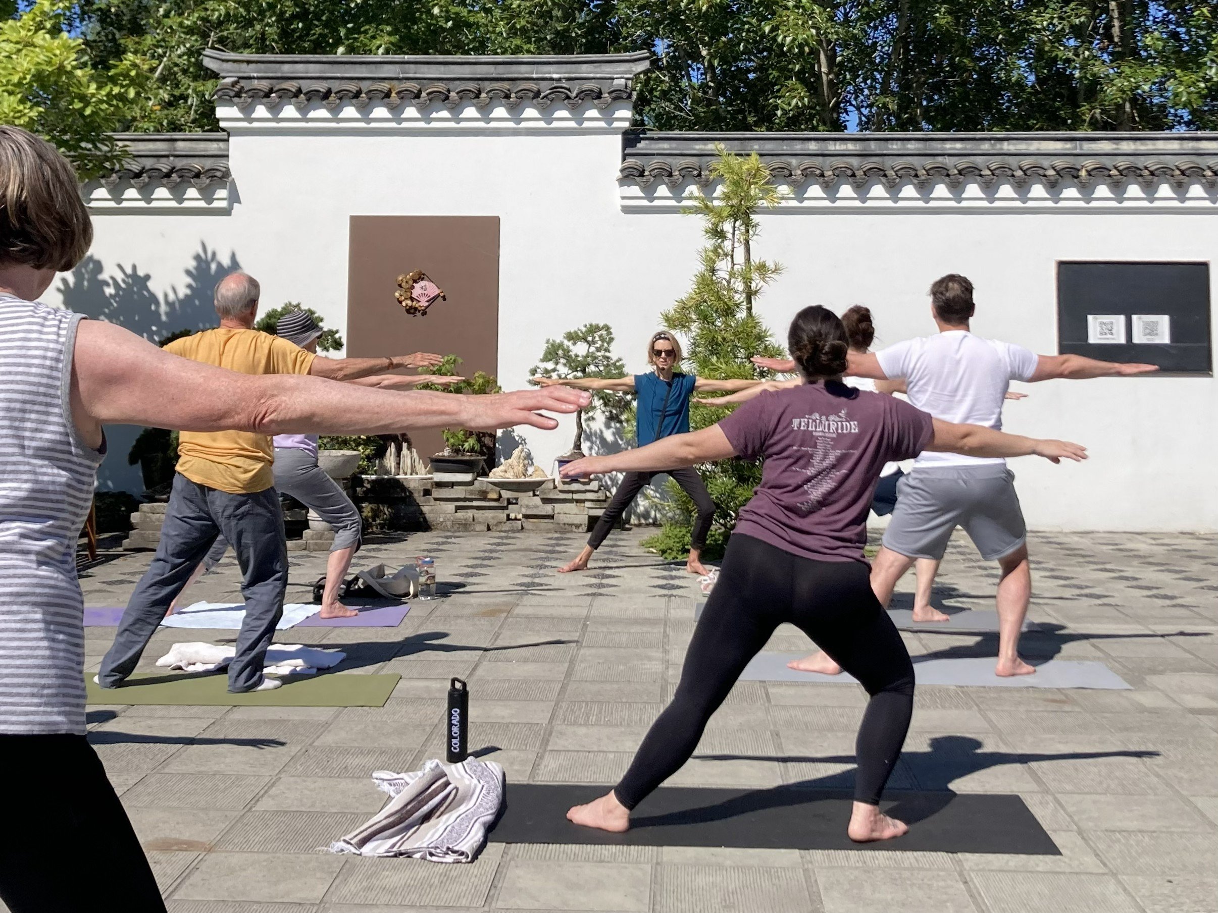 People practicing yoga at the Seattle Chinese Garden