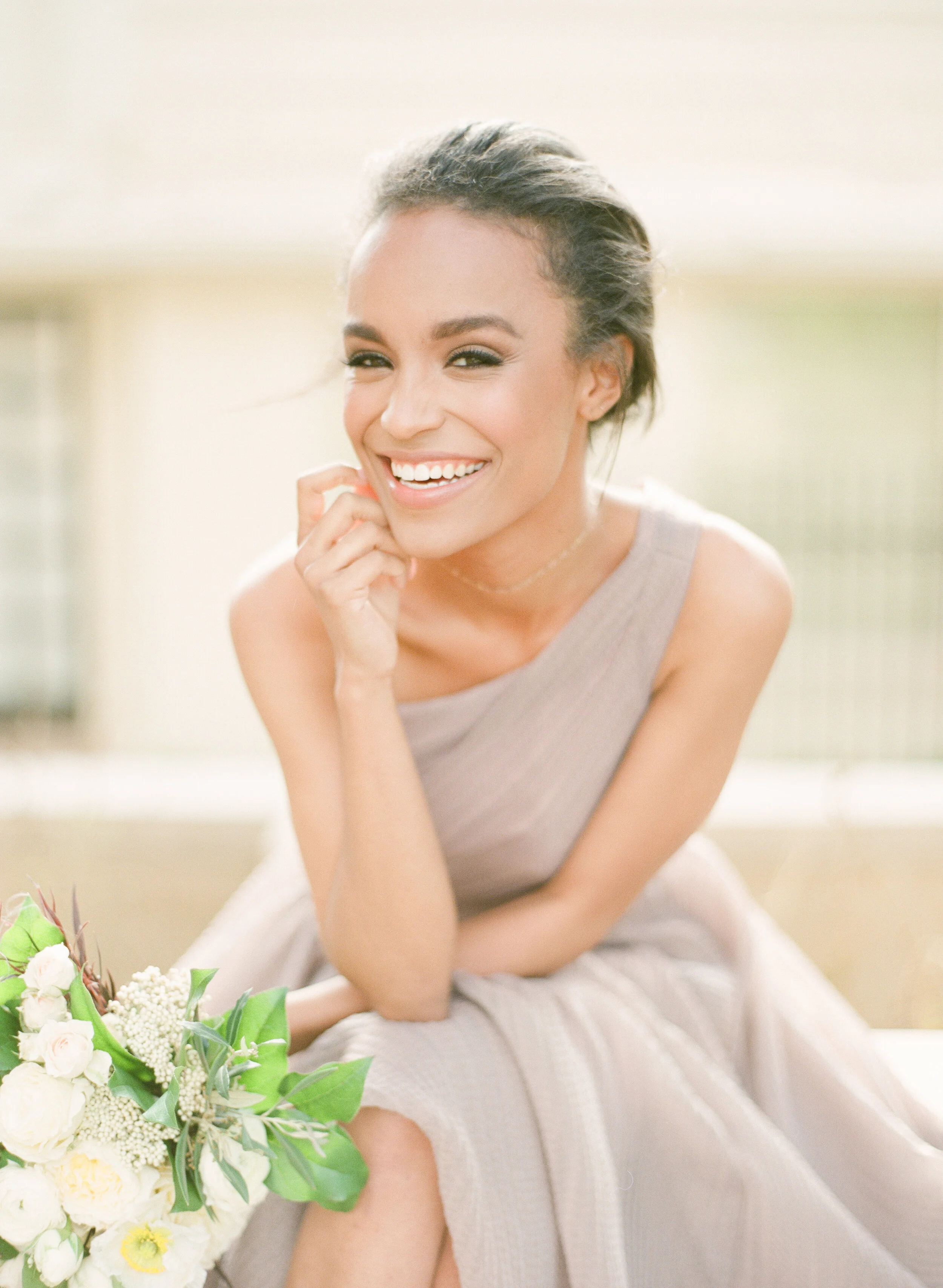 Black bride with big beautiful smile and blush Carol Hannah wedding dress