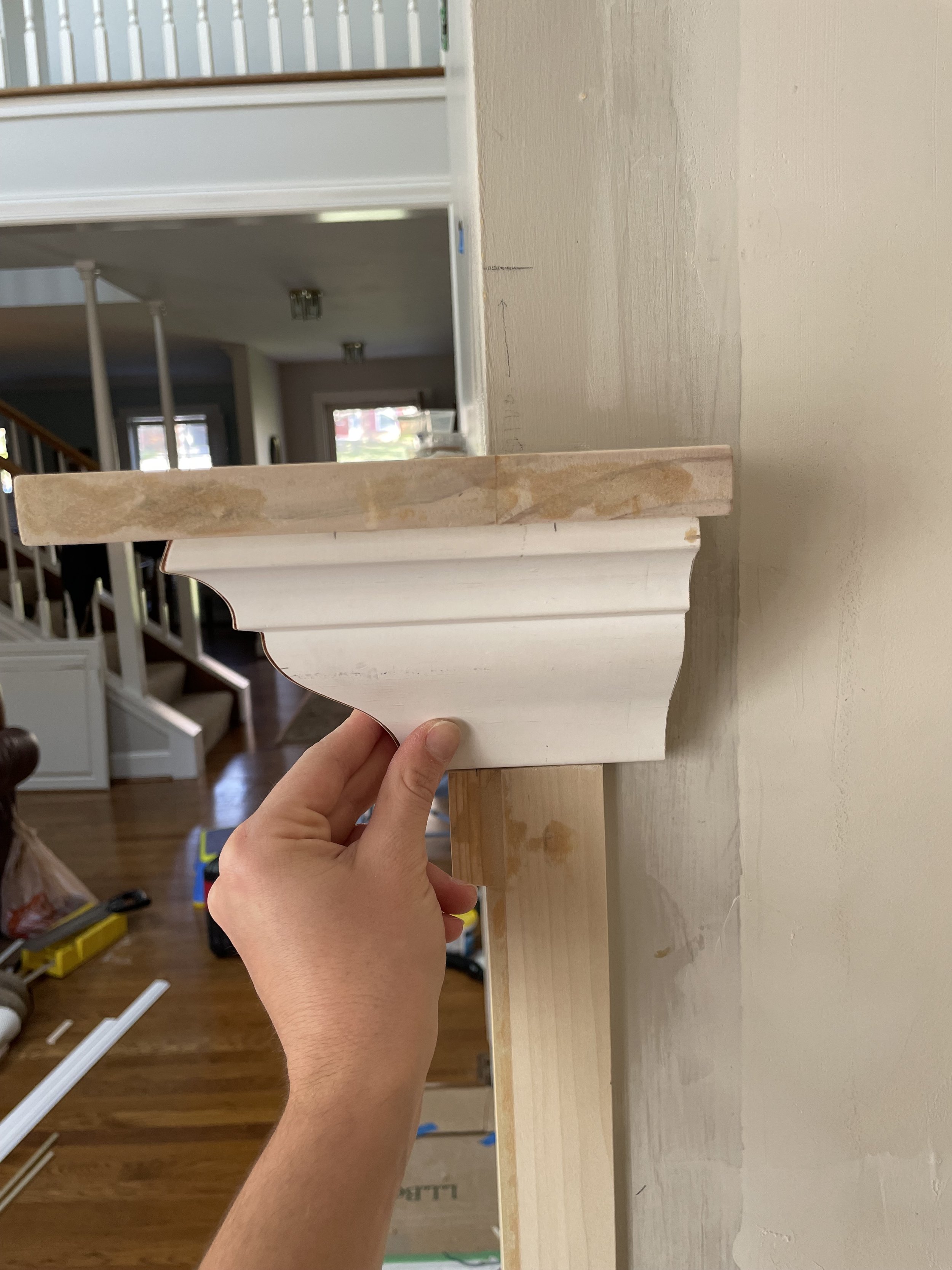 the mantle was designed to be hollow with a magnetic end piece to allow TV and sound bar wires to be easily fed down to an outlet in the right cabinet