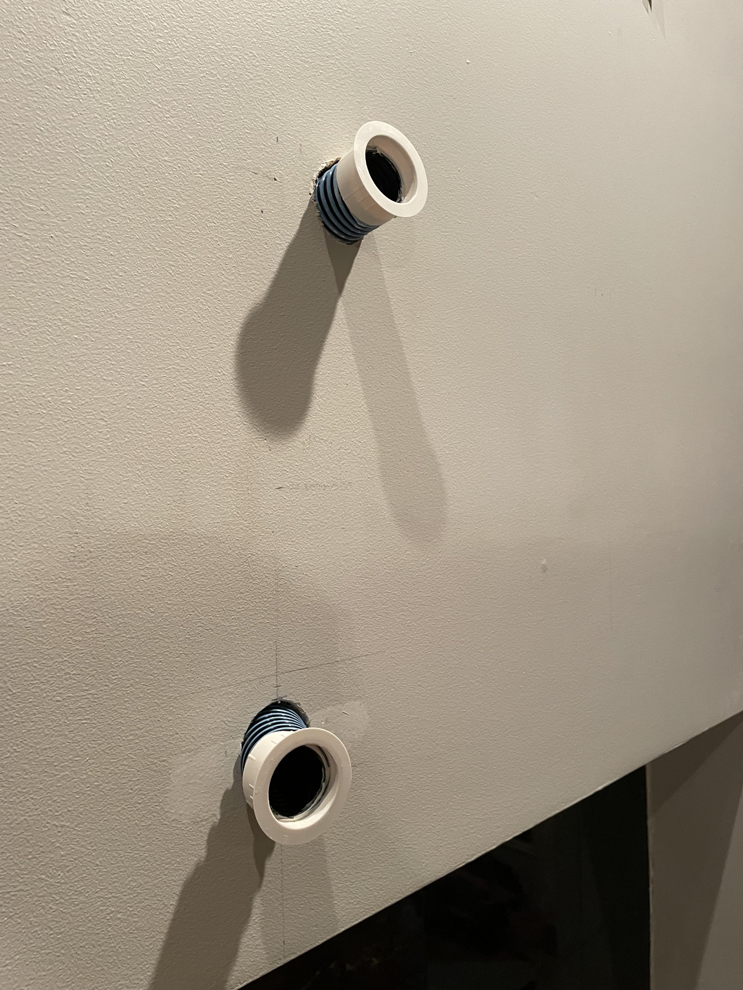 Creating a path for TV wires to be fed through the mantle and wall into the cabinet