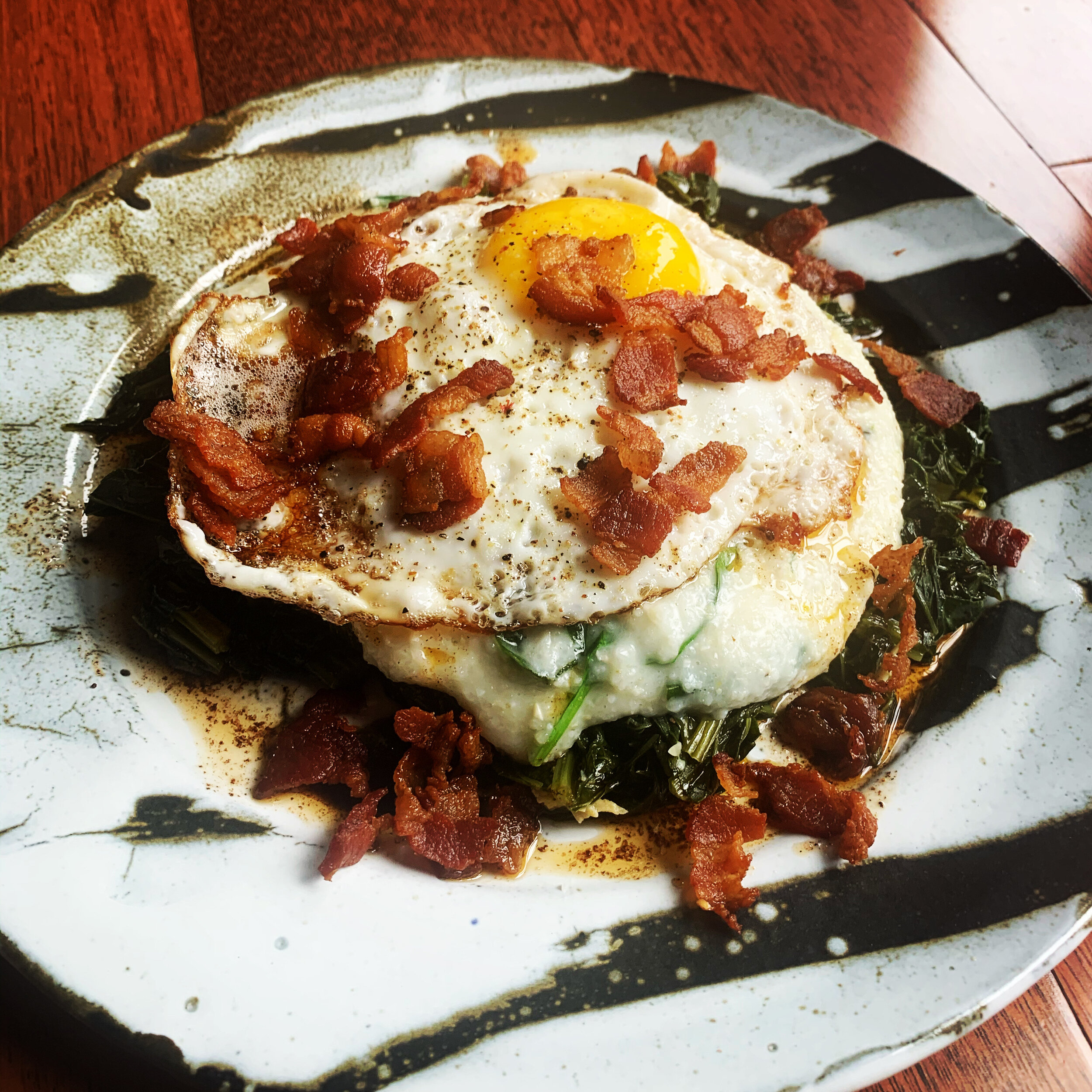 Fried Eggs with Greens, Bacon and Grits