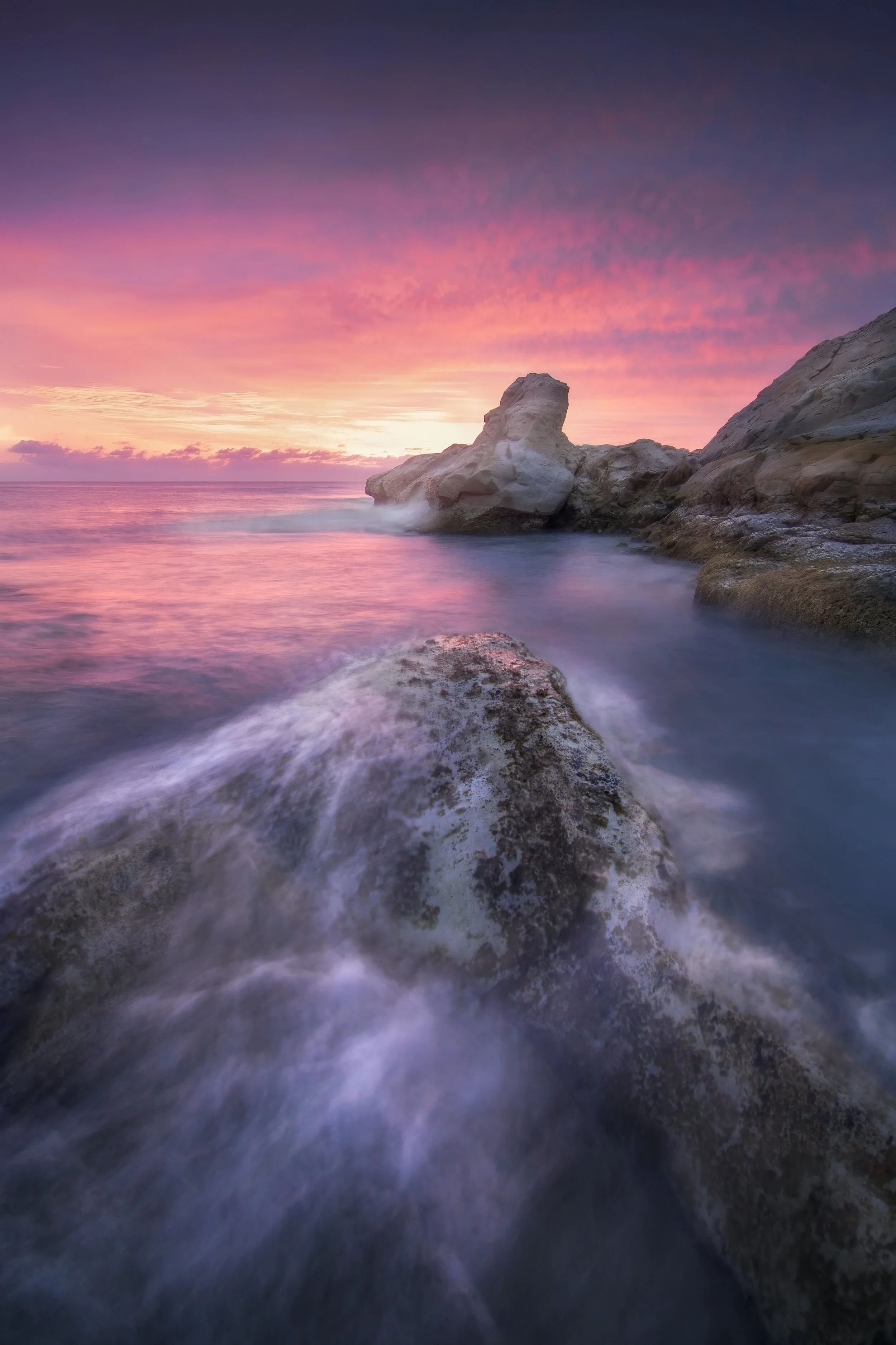 At last, after many attempts visiting this place , I returned back and finally witnessed this amazing sunrise.
The search for a composition was difficult because the main subject was surrounded by big rocks. So I had to go further. 
I noticed this ro