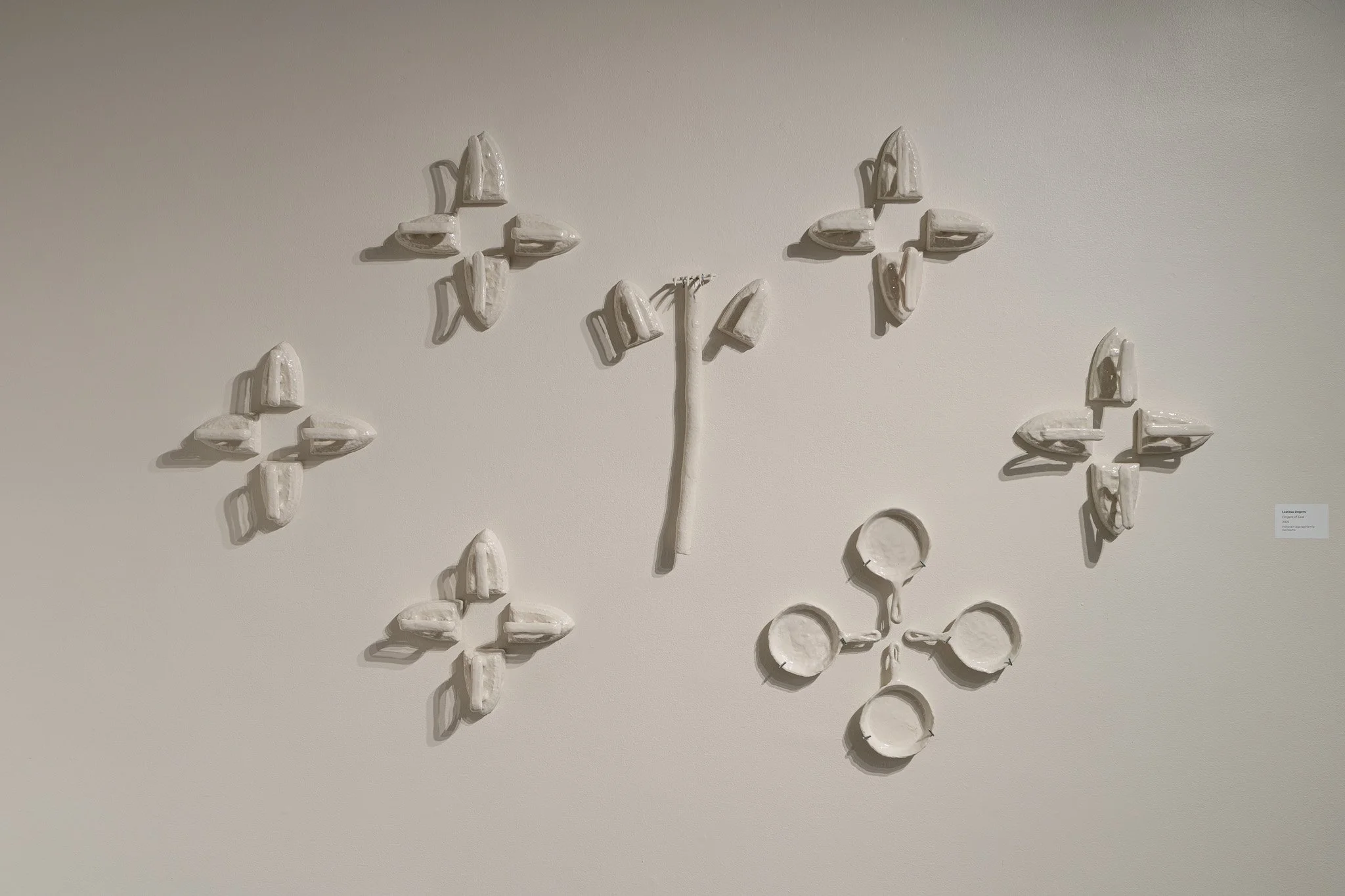 LaRissa Rogers,  Fingers of God , 2025, porcelain slip cast family heirlooms

