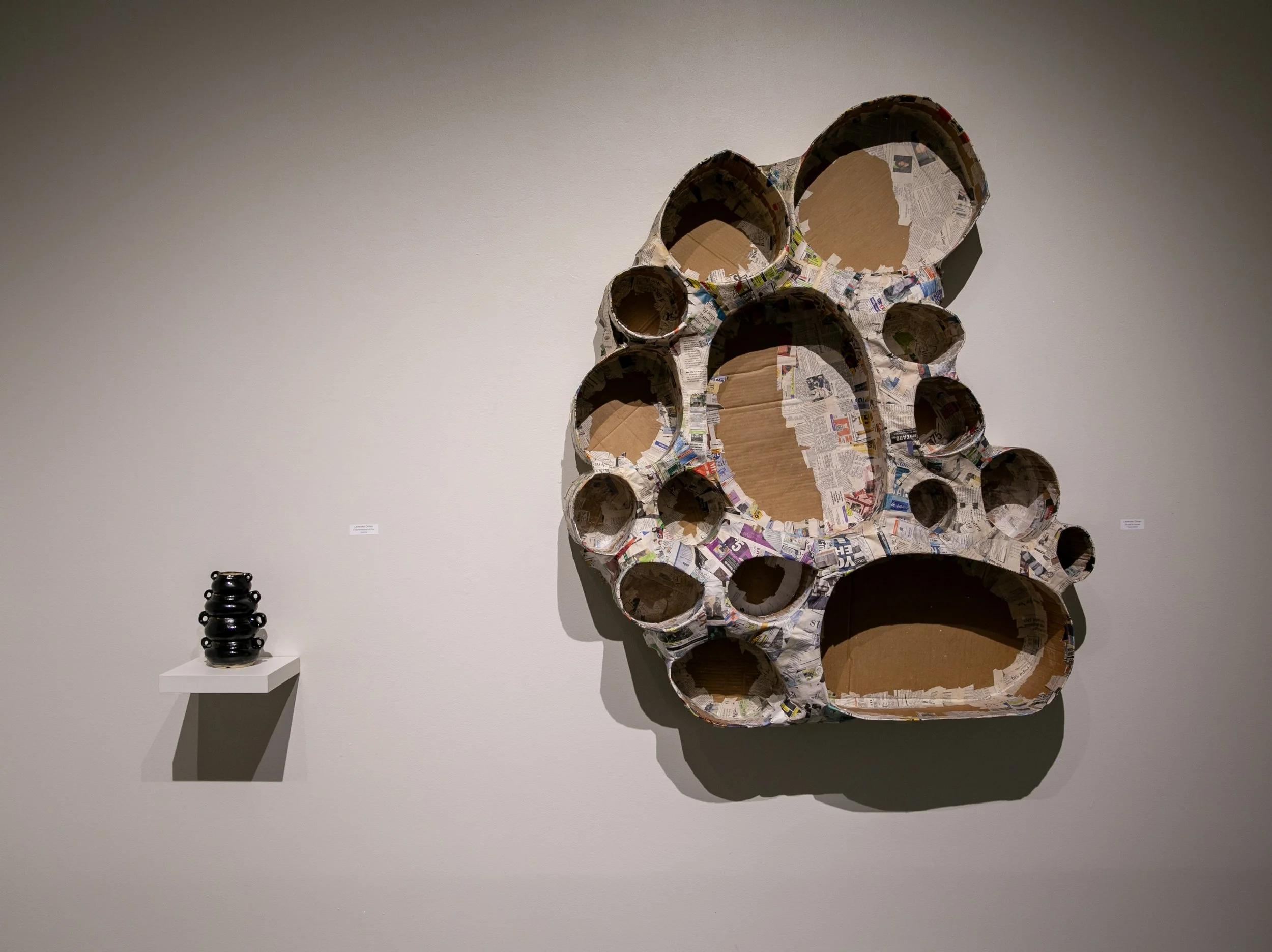 Lavender Oman,  Found in Home , papier-mâché (right)
