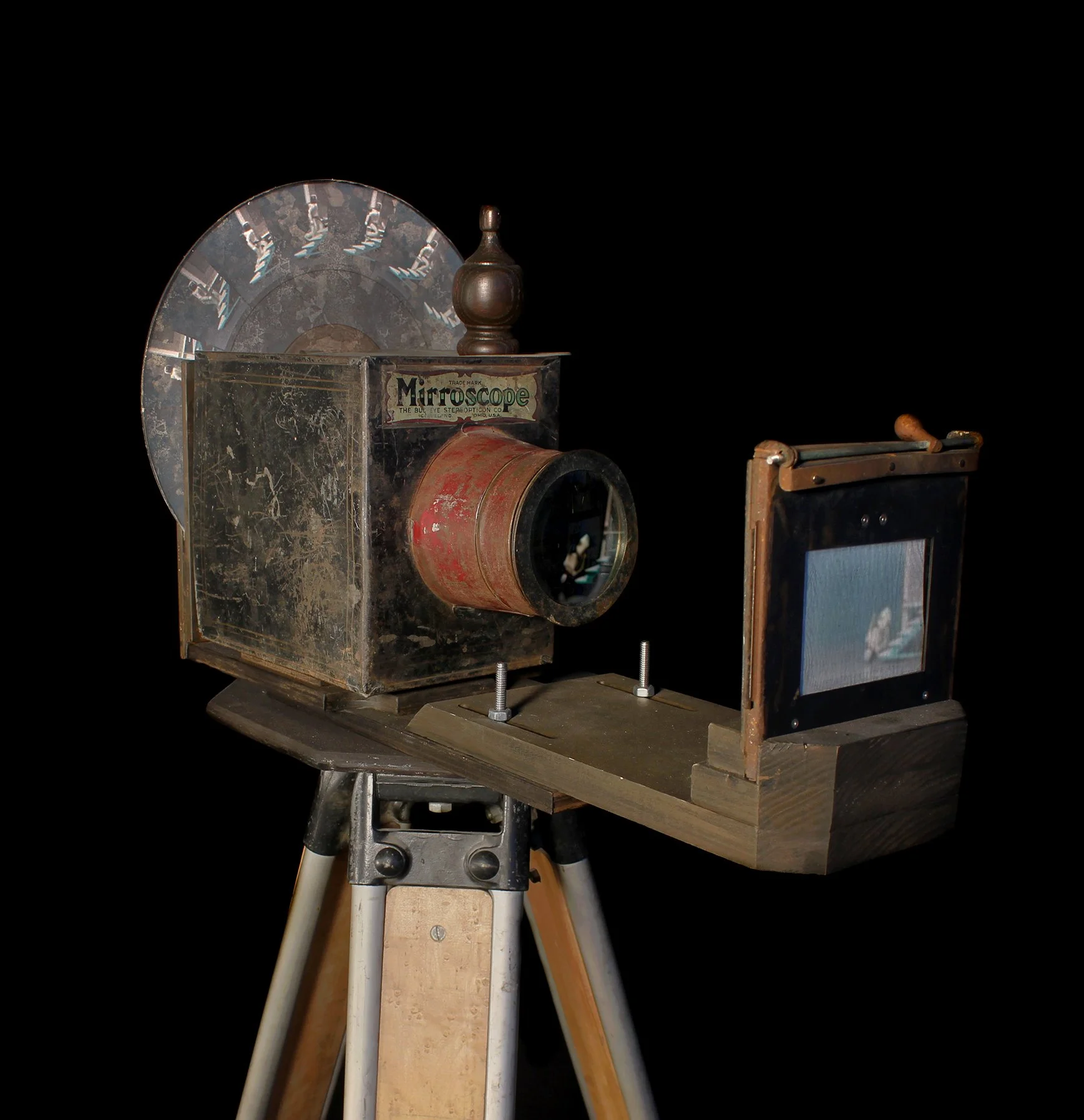  Asimo , 2013, surveyors tripod, wood, wigital projector, media player, opaque projector, film enlarger frame, motor, vinyl album, digital print