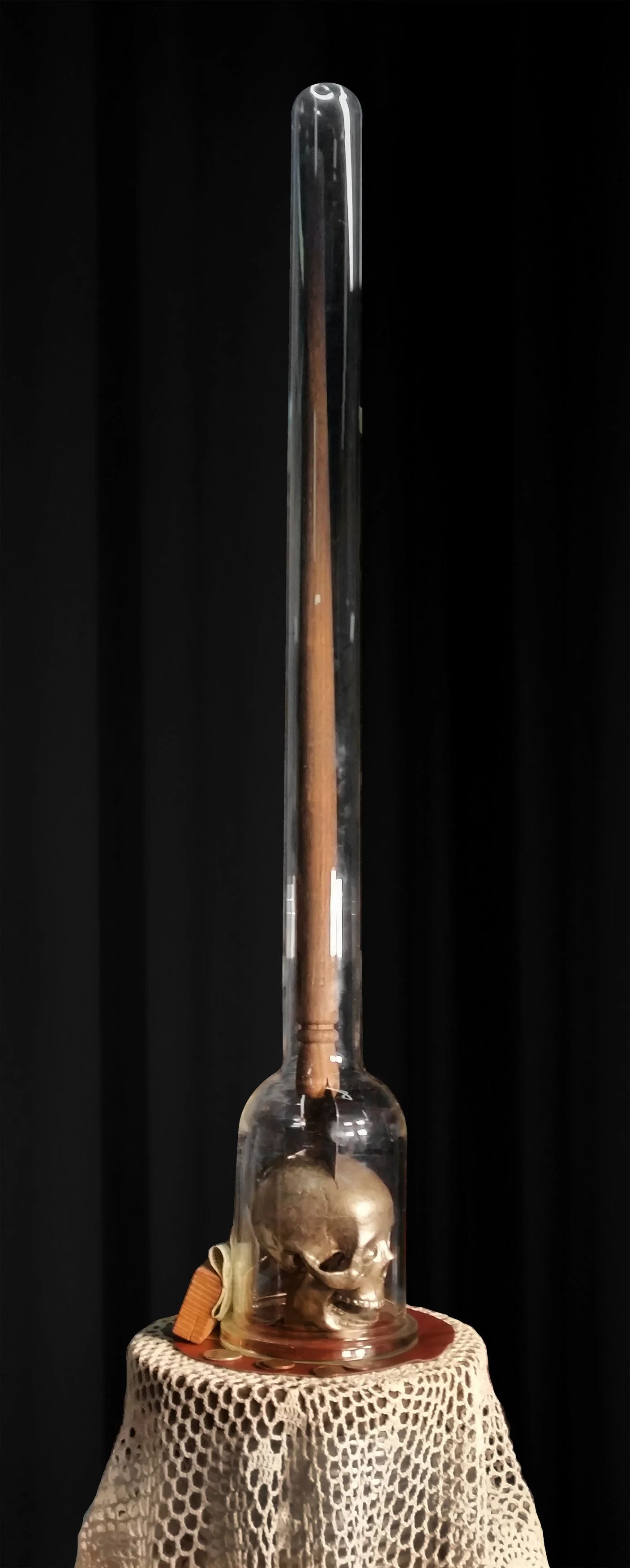  St. Soborno , 2022, surveyors tripod, glass chemistry vessel, resin skull, wood, steel, cloth, coins enamel