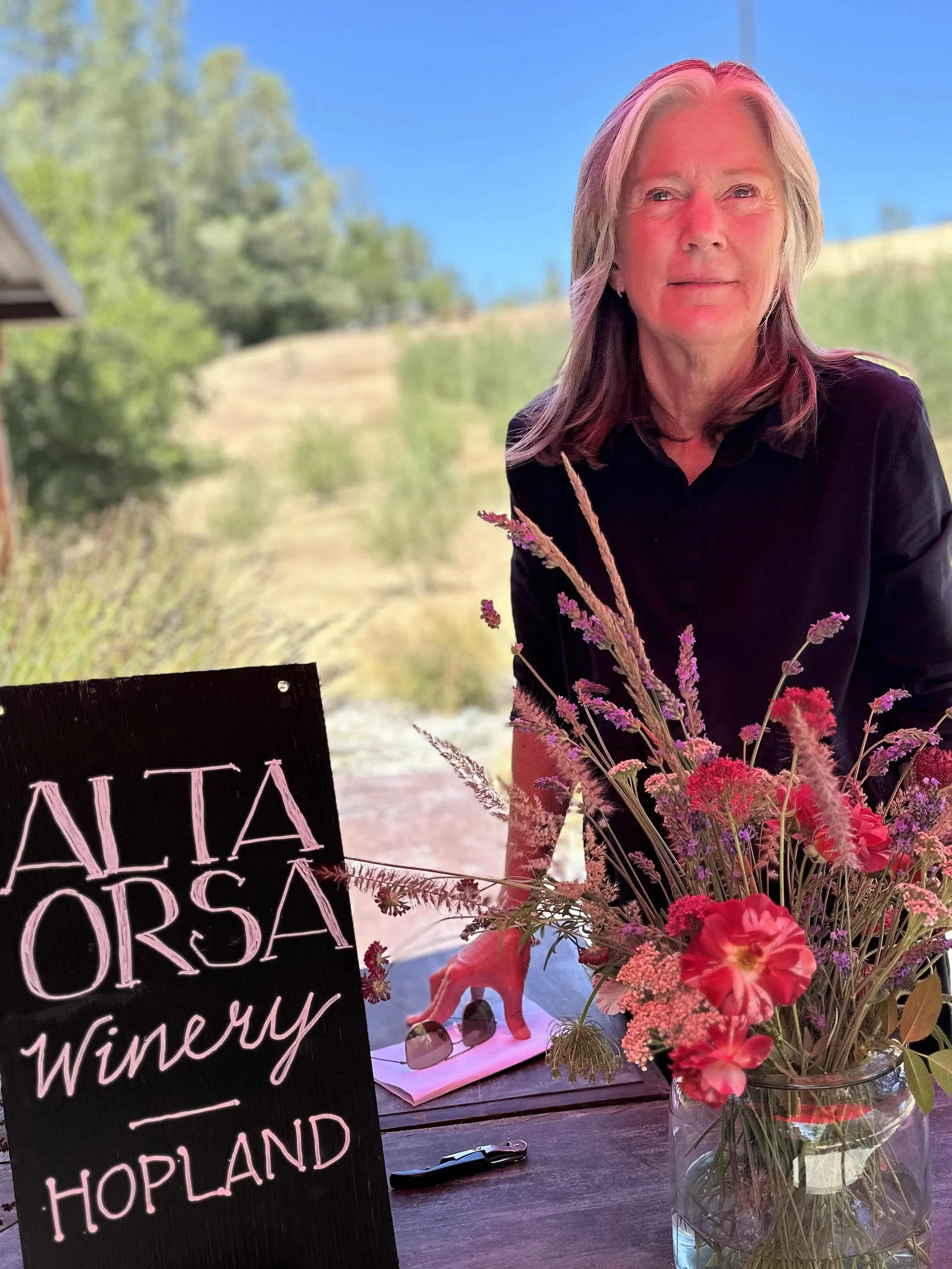 Shirley Lenehan pouring Alta Orsa Wine